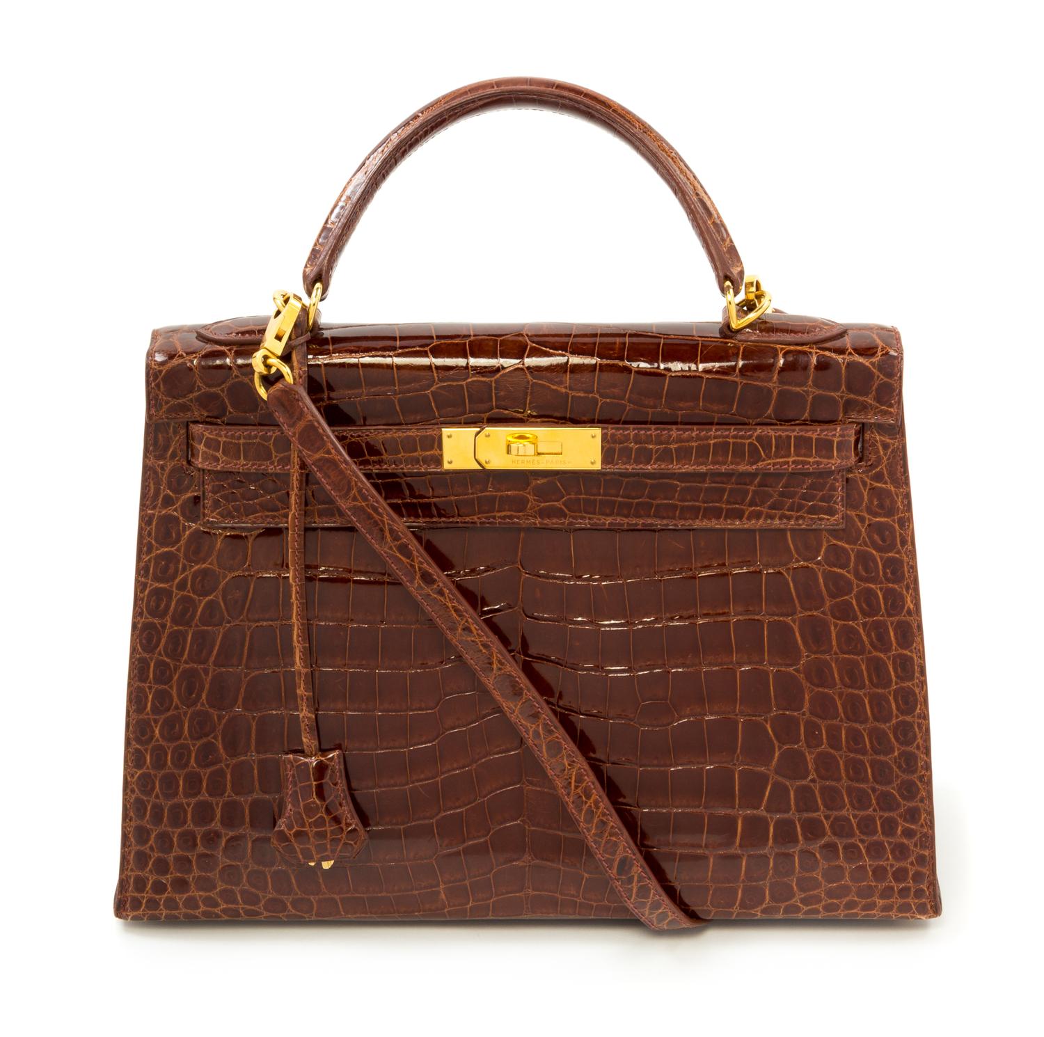 An Hermès Brown Niloticus Crocodile Sellier 32cm Kelly Handbag, 12.5" x 5" x 9.5"; Handle drop: 3.25".