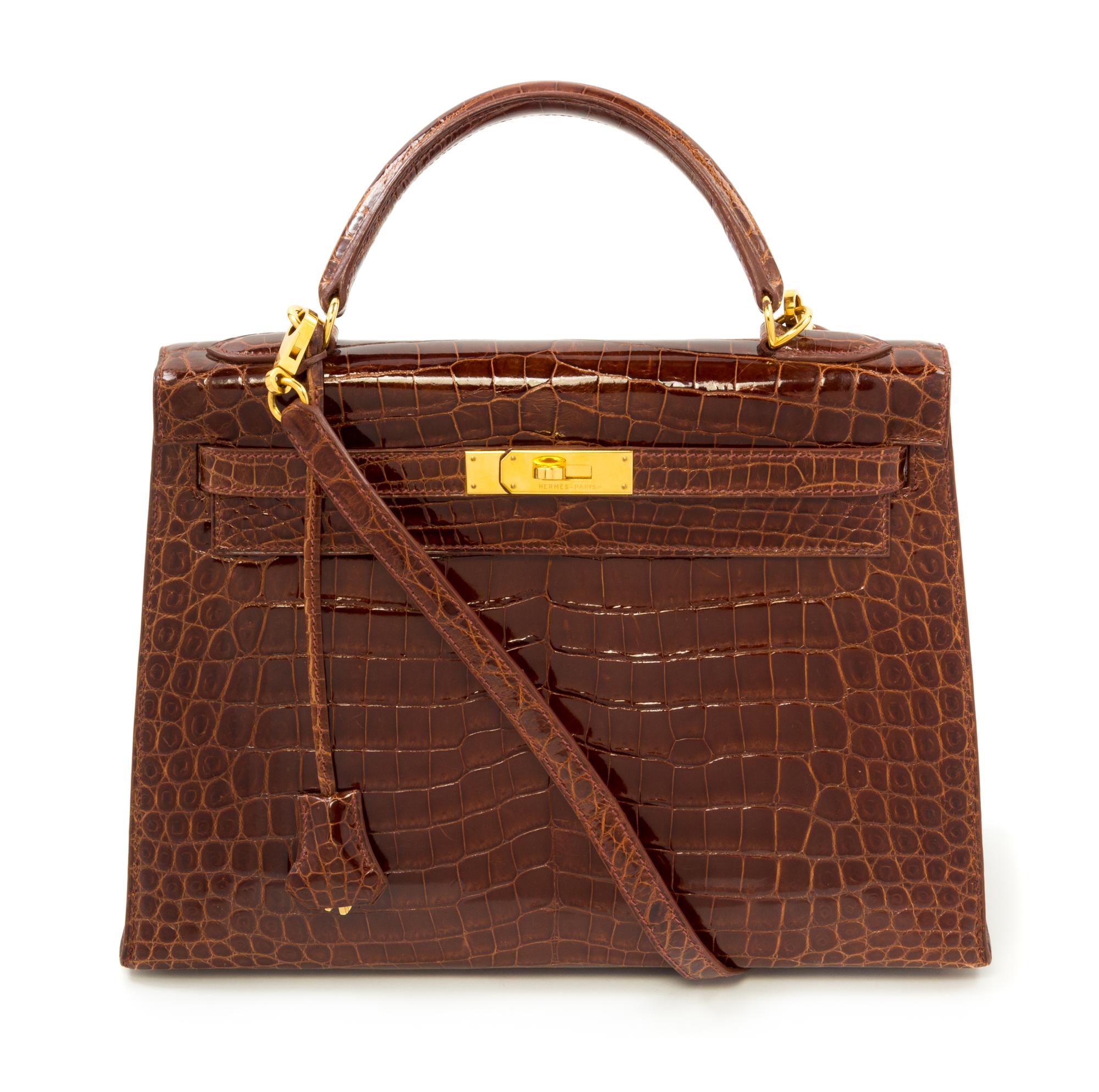 An Hermès Brown Niloticus Crocodile Sellier 32cm Kelly Handbag, 12.5" x 5" x 9.5"; Handle drop: 3.25".