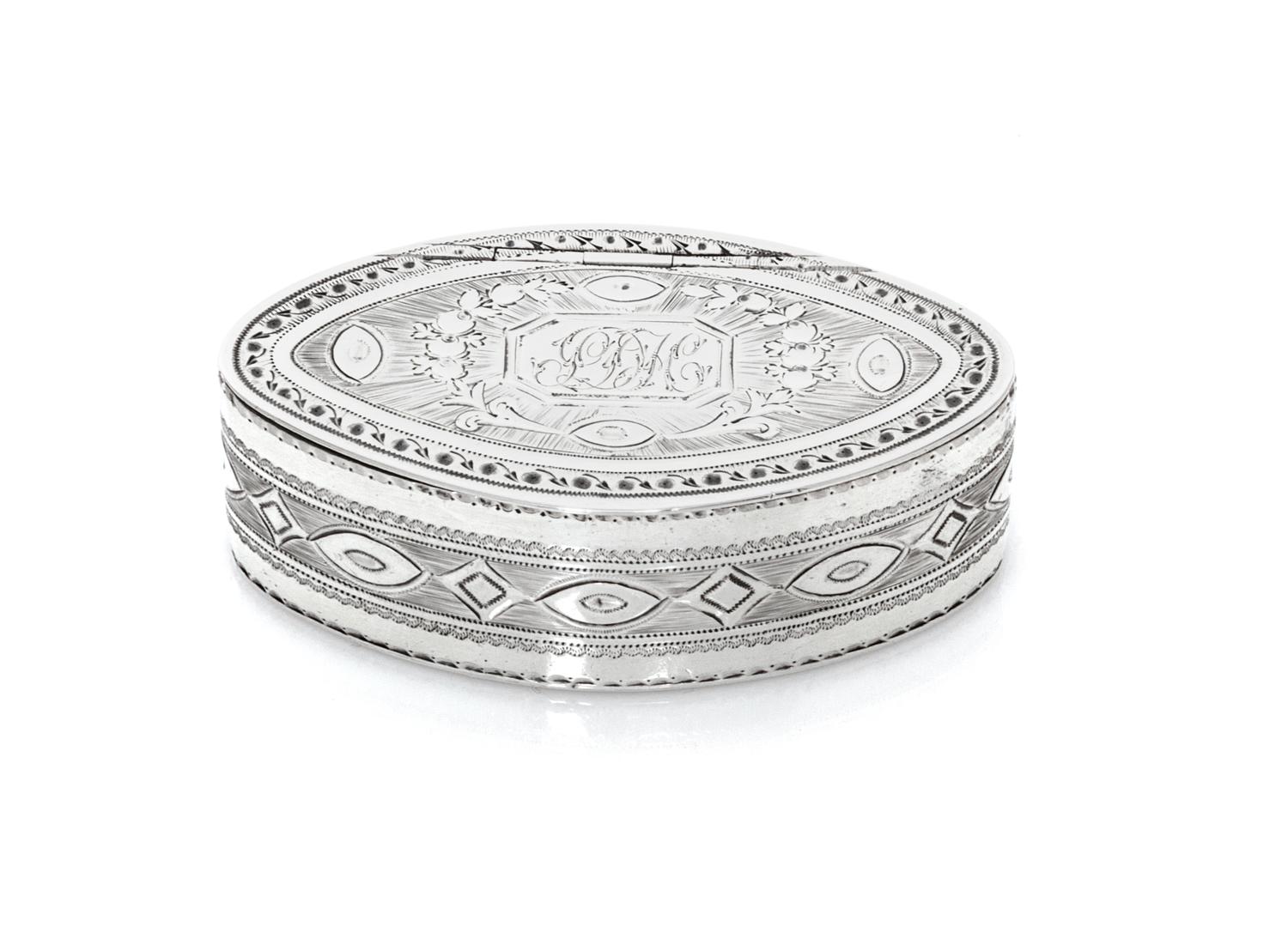 A George IV Snuff Box, James White, London, 1830, of oval form, the hinged lid centered by a rectangular monogrammed cartouche surround