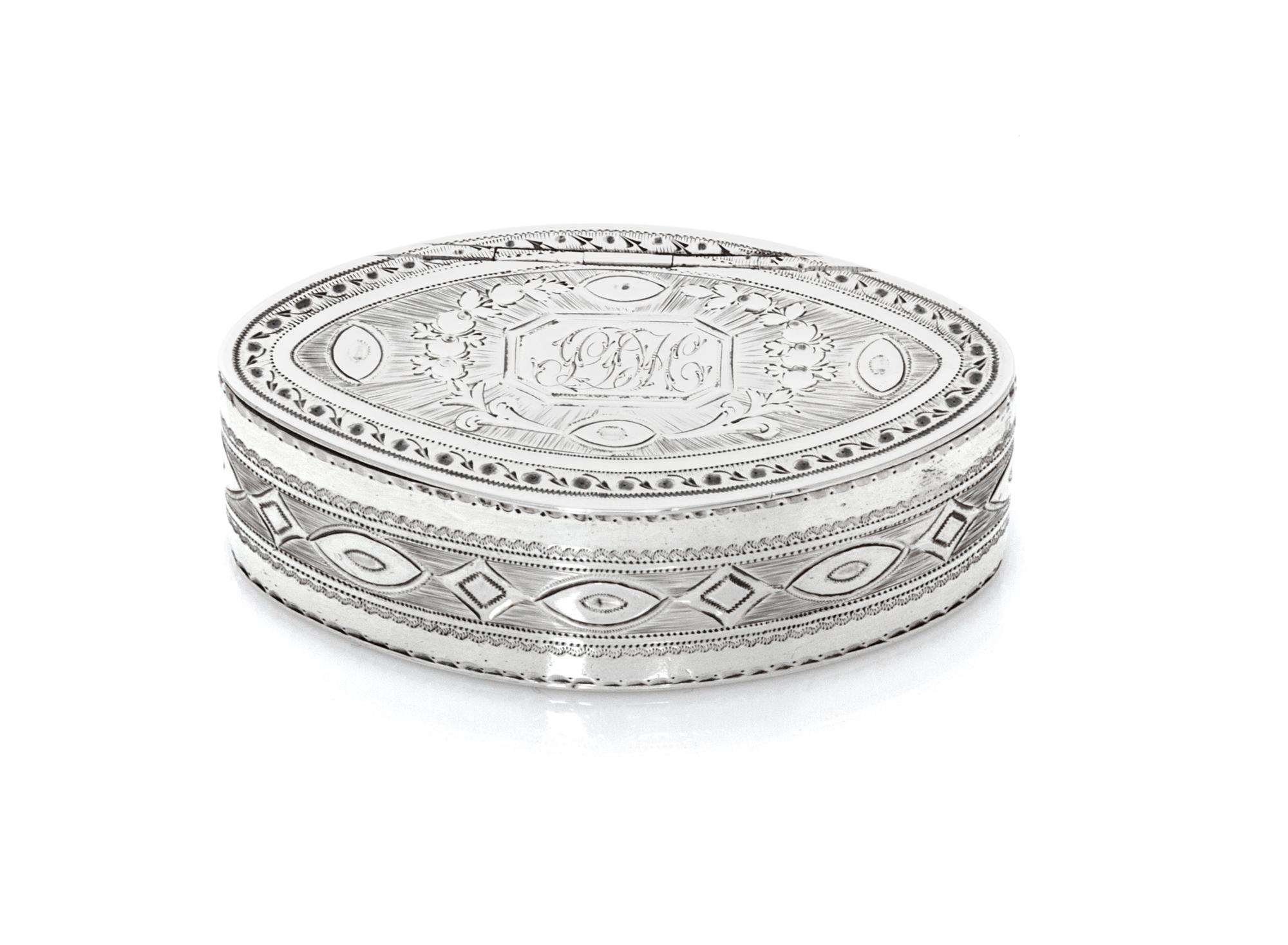 A George IV Snuff Box, James White, London, 1830, of oval form, the hinged lid centered by a rectangular monogrammed cartouche surround