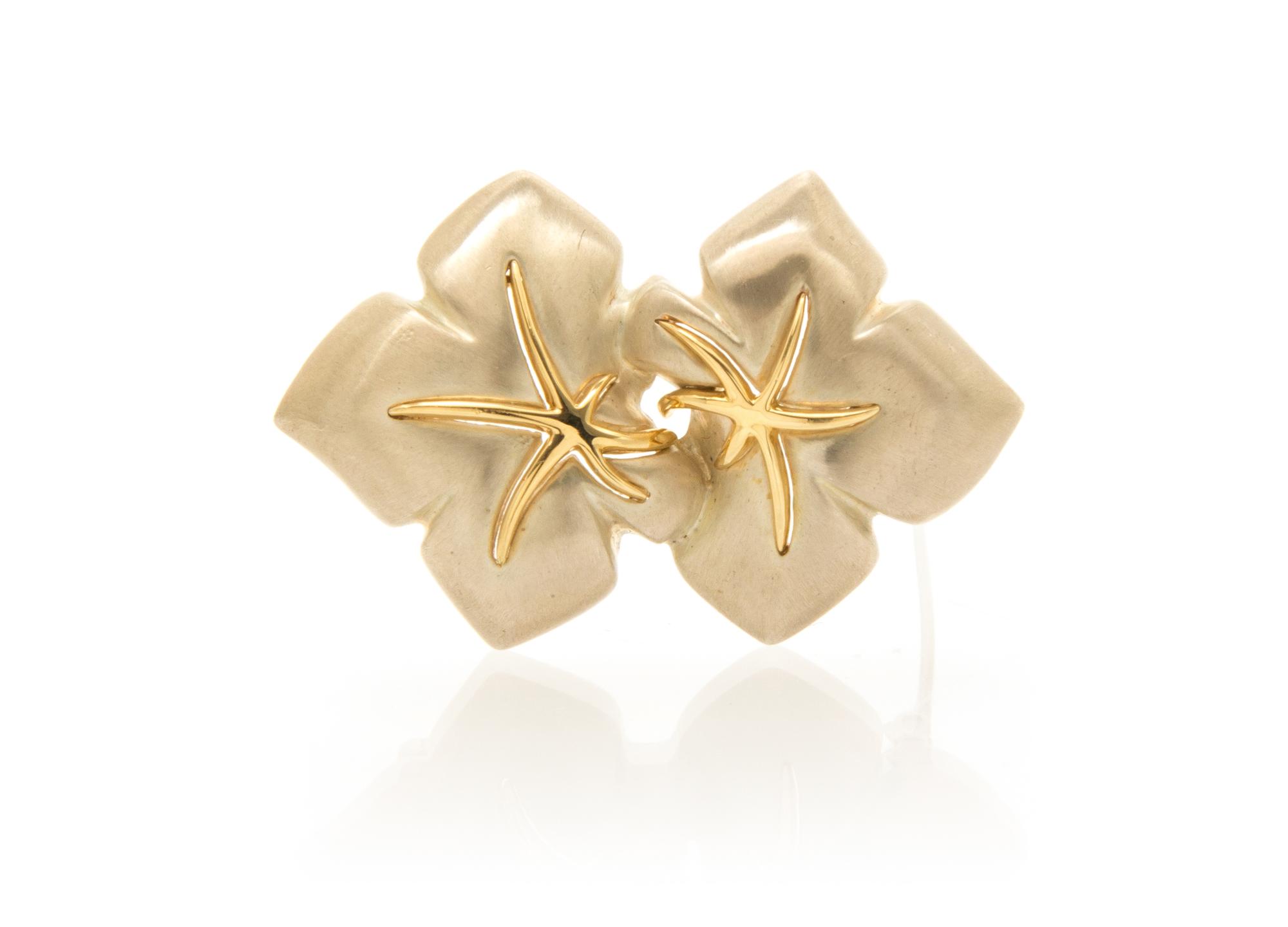 A Sterling Silver and 18 Karat Yellow Gold Brooch, Tiffany & Co., Circa 1991, 11.10 dwts.