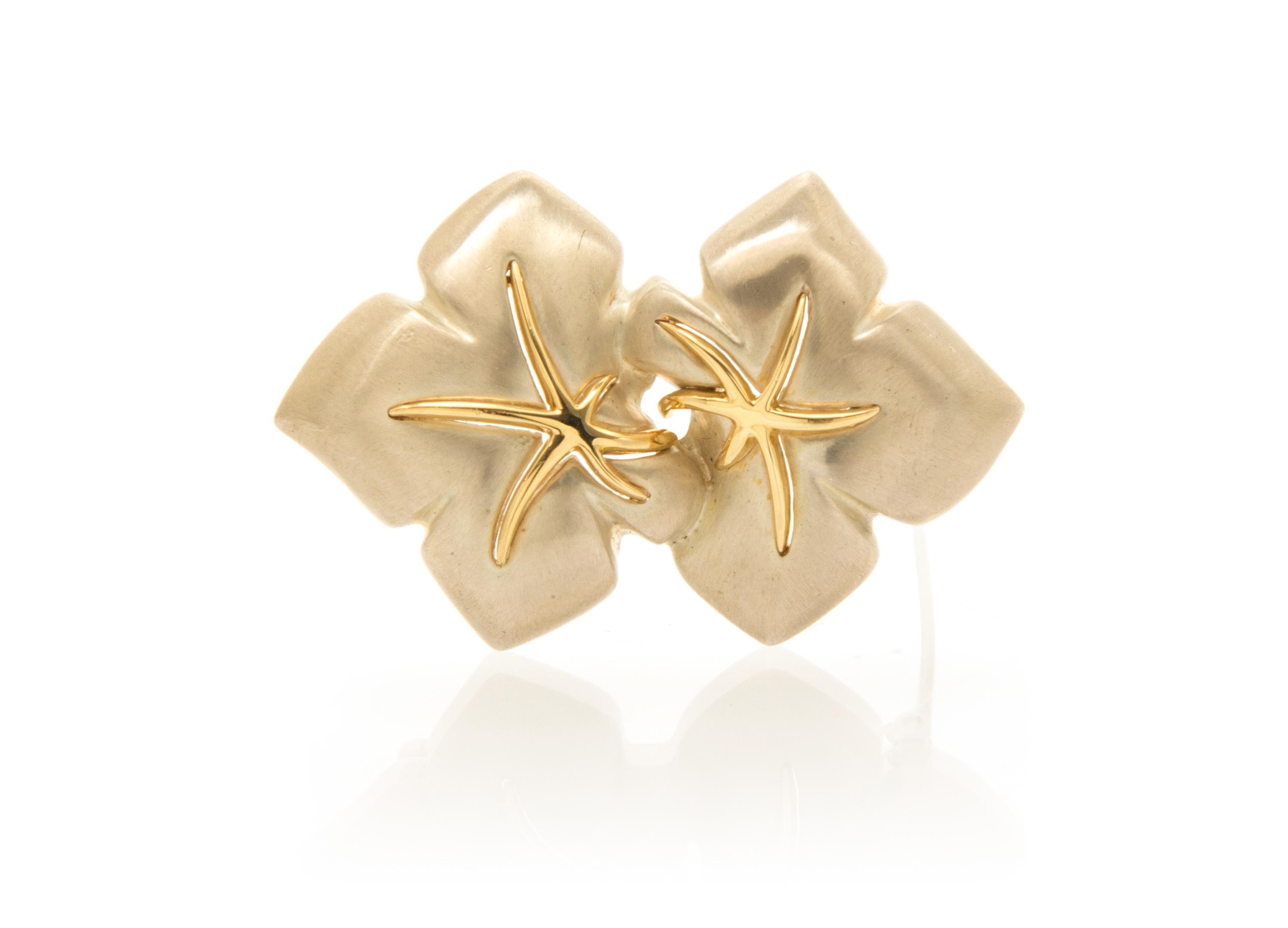 A Sterling Silver and 18 Karat Yellow Gold Brooch, Tiffany & Co., Circa 1991, 11.10 dwts.
