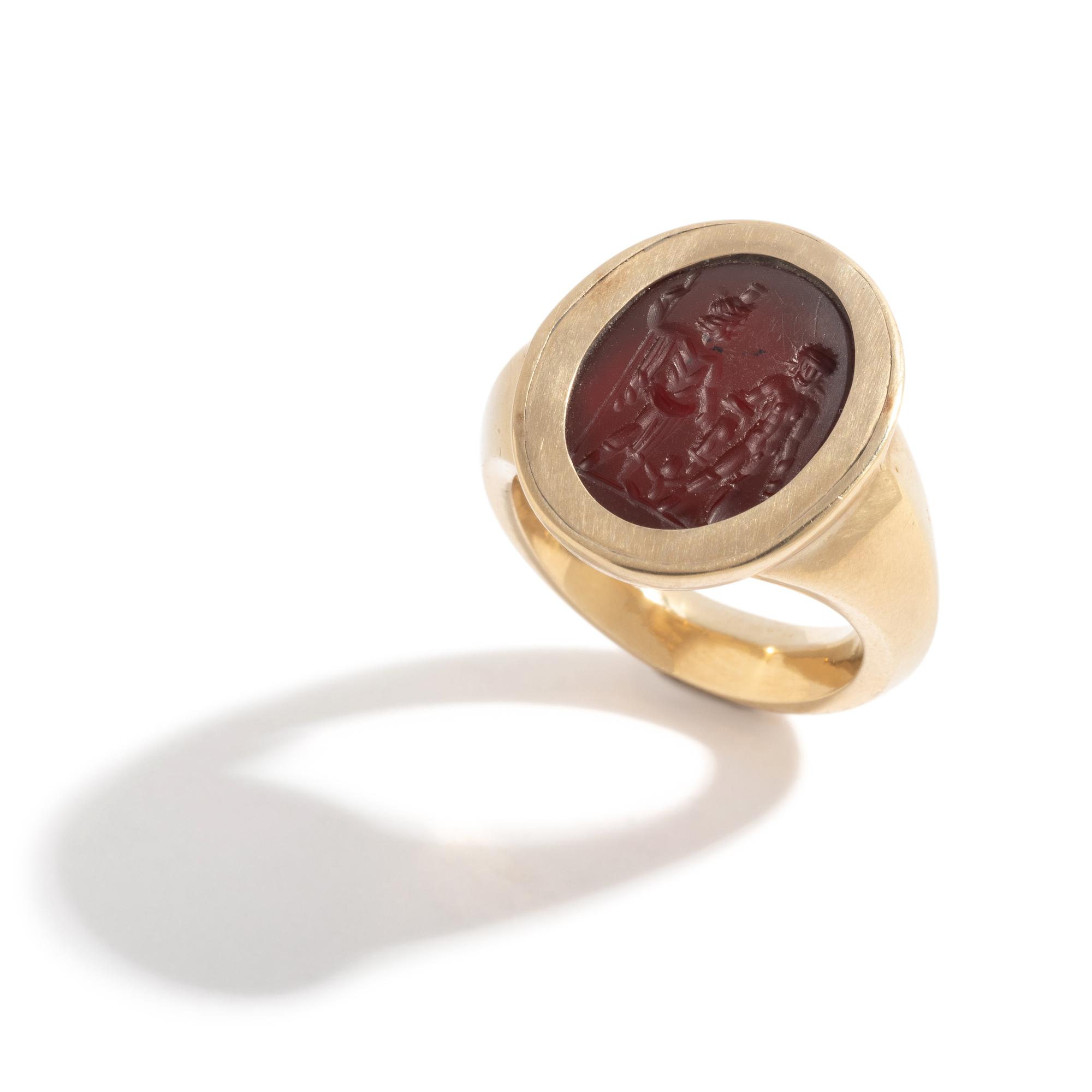 A Roman Carnelian Ring Stone with Two Male Deities and a Child — Set in a gold ring