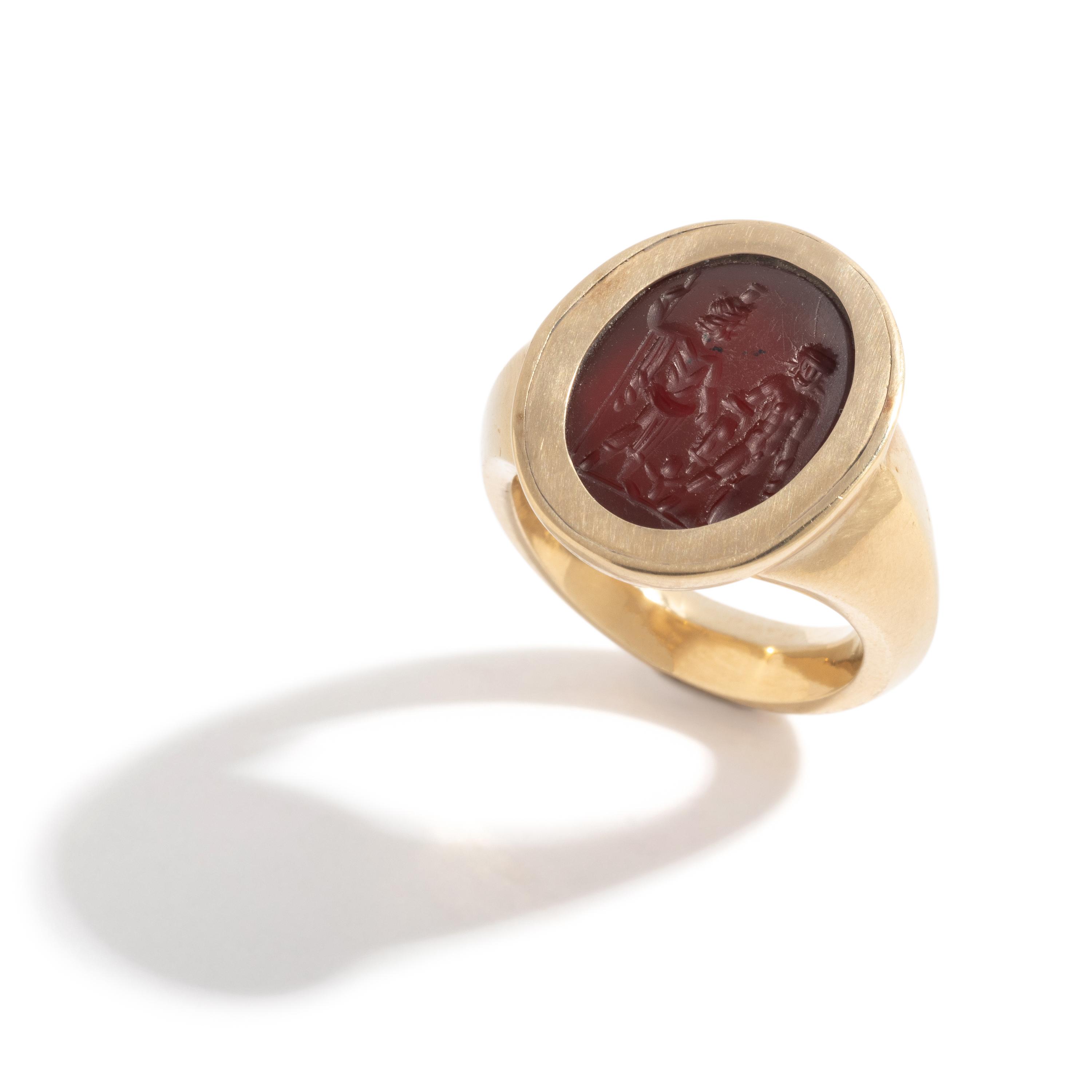 A Roman Carnelian Ring Stone with Two Male Deities and a Child — Set in a gold ring