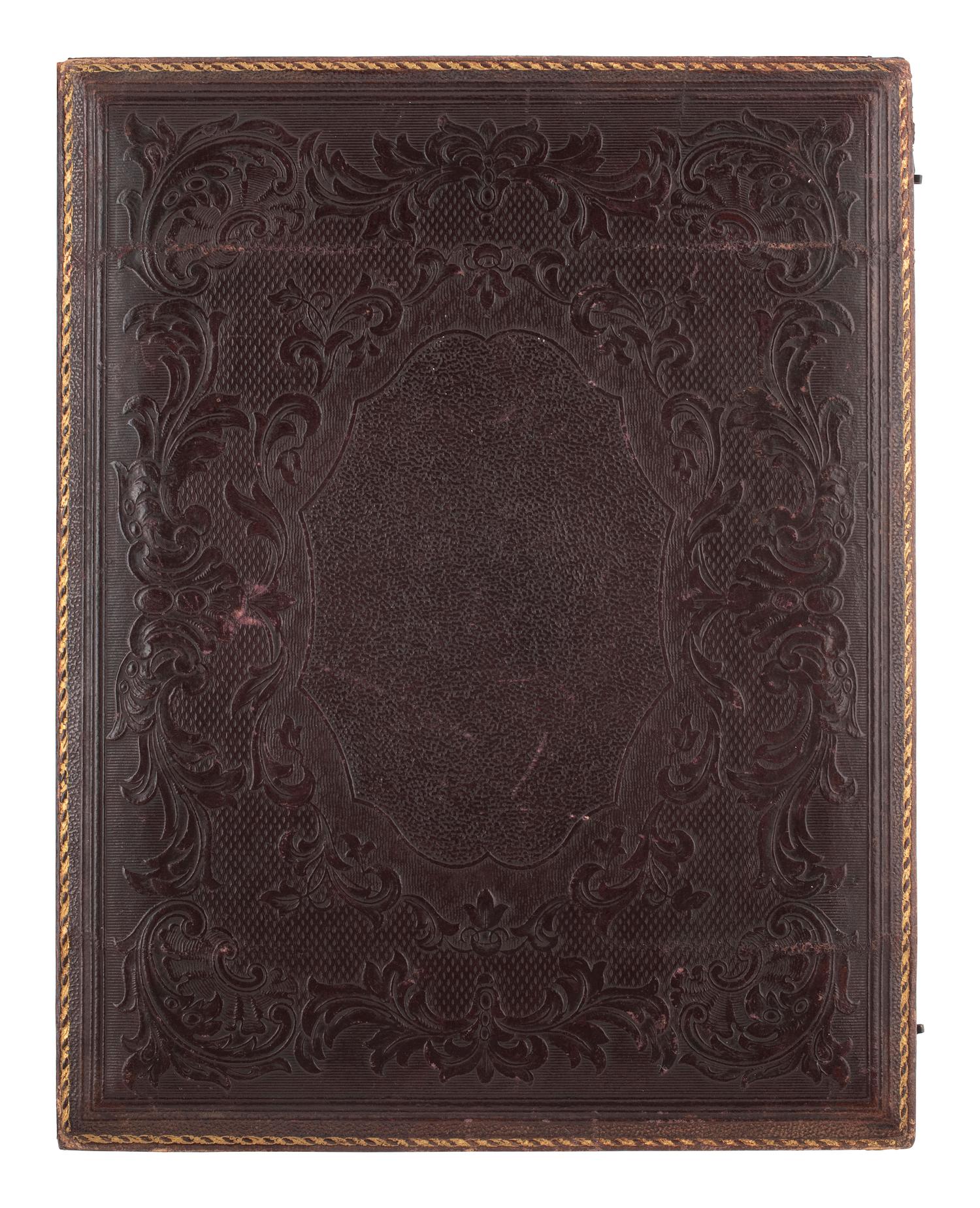 [EARLY PHOTOGRAPHY]. Whole plate ambrotype of a family of three.