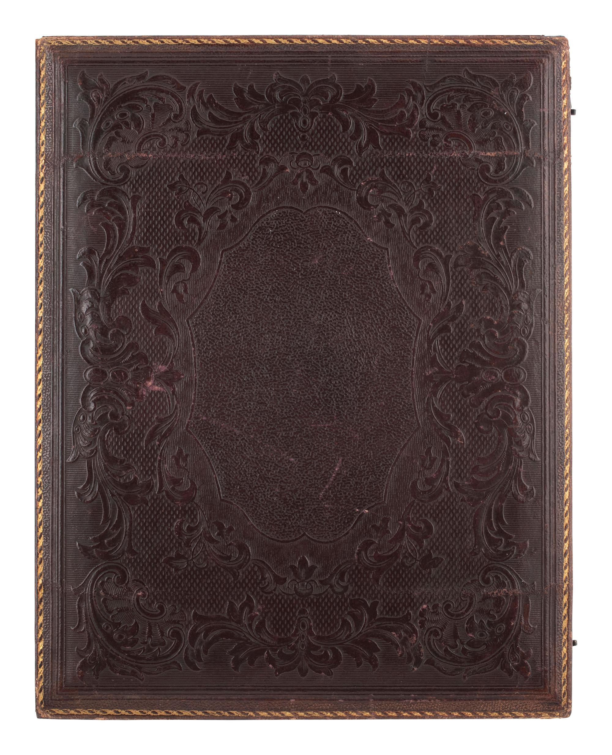 [EARLY PHOTOGRAPHY]. Whole plate ambrotype of a family of three.