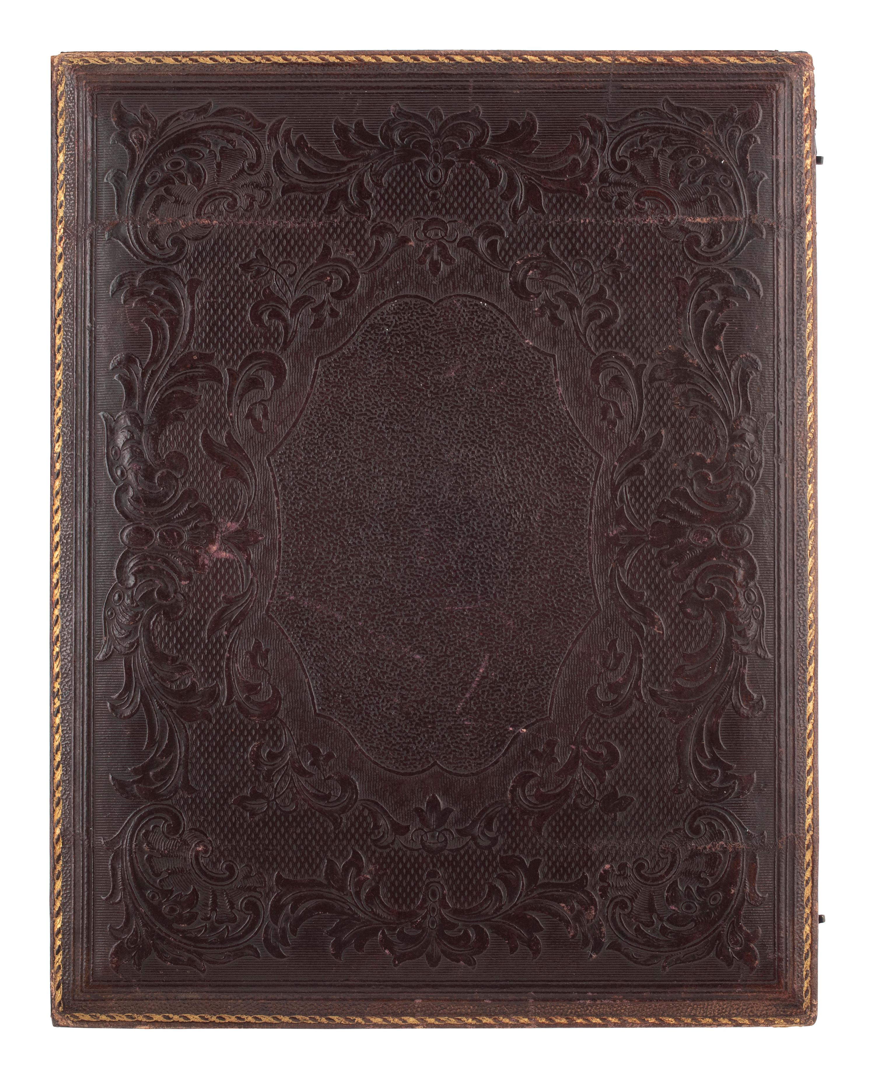 [EARLY PHOTOGRAPHY]. Whole plate ambrotype of a family of three.