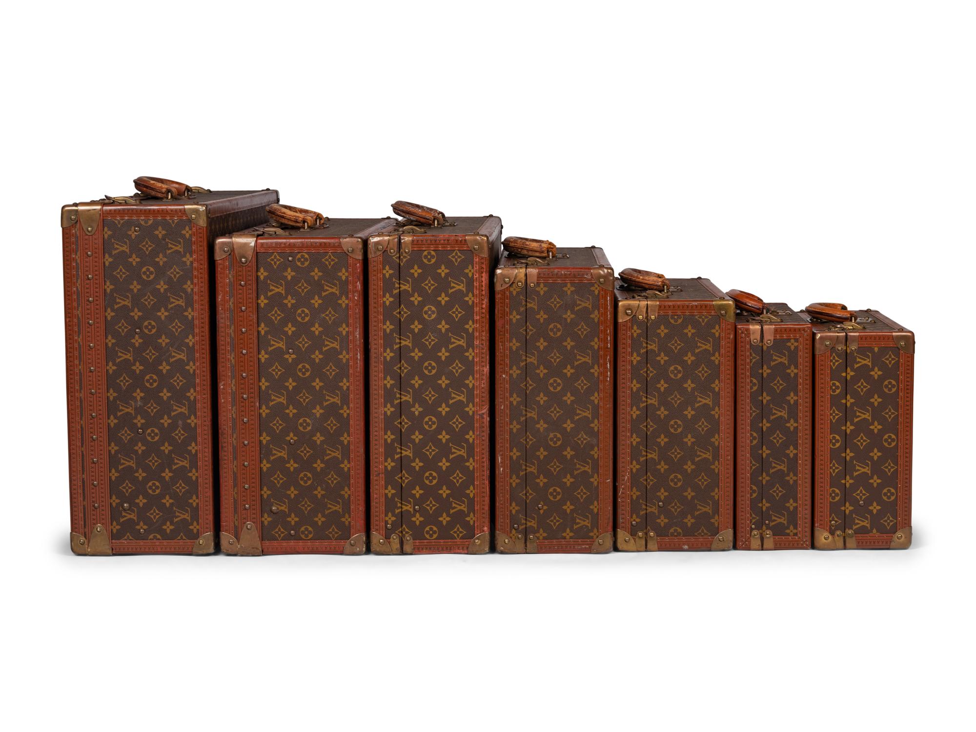 A Group of Seven Louis Vuitton Hardside Suitcases