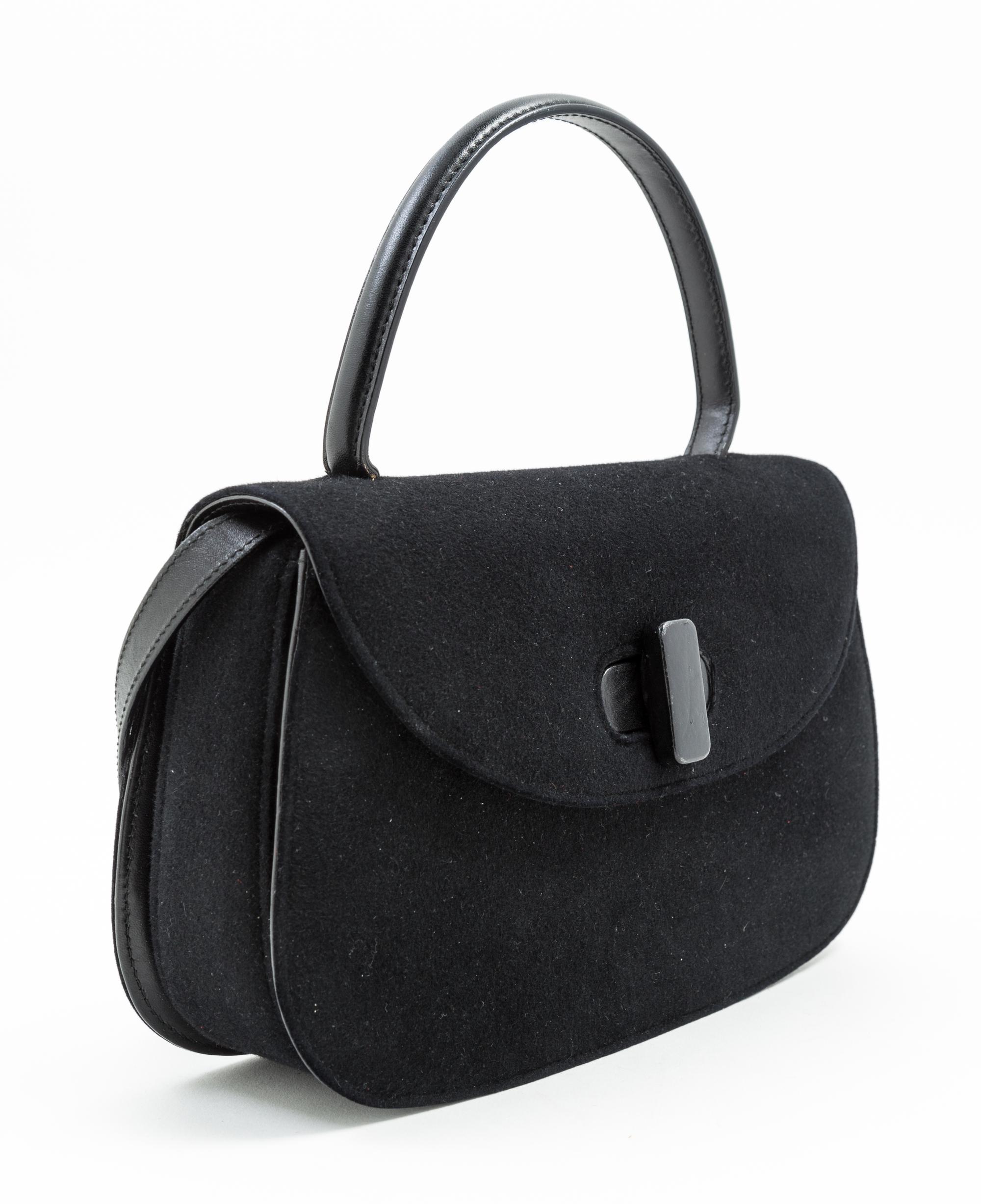 A Gucci Black Suede Flap Handbag, 11" x 7" x 2.5"; Handle drop: 4.5".