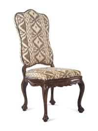 A Set of Eight Italian Baroque Style Fruitwood Dining Chairs