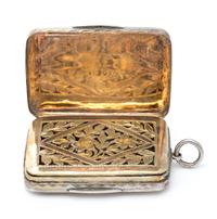 A George III Silver Vinaigrette, Samuel Pemberton, Birmingham, 1786, having a geometric decorated lid centered by an engraved cartouche