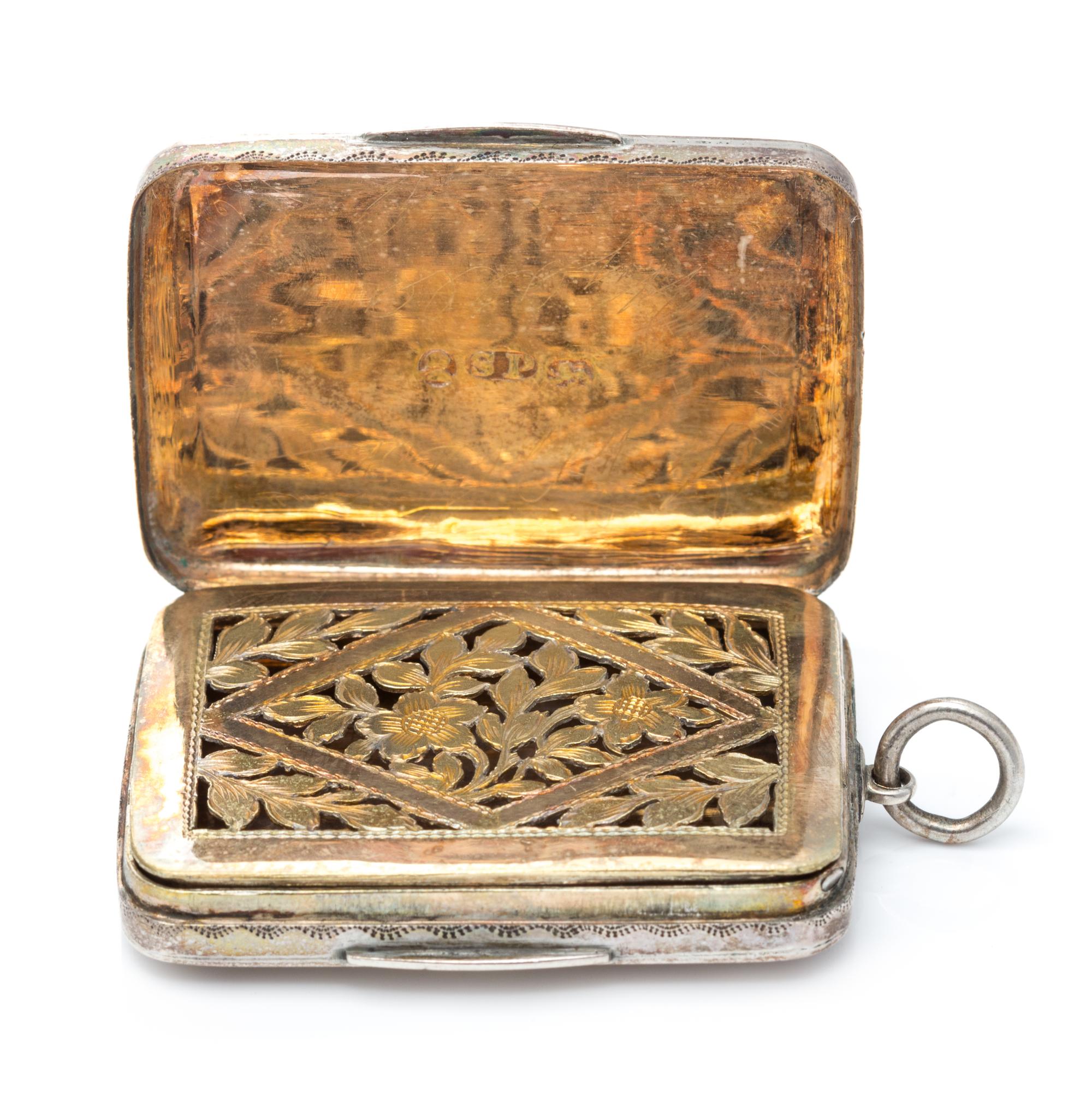 A George III Silver Vinaigrette, Samuel Pemberton, Birmingham, 1786, having a geometric decorated lid centered by an engraved cartouche