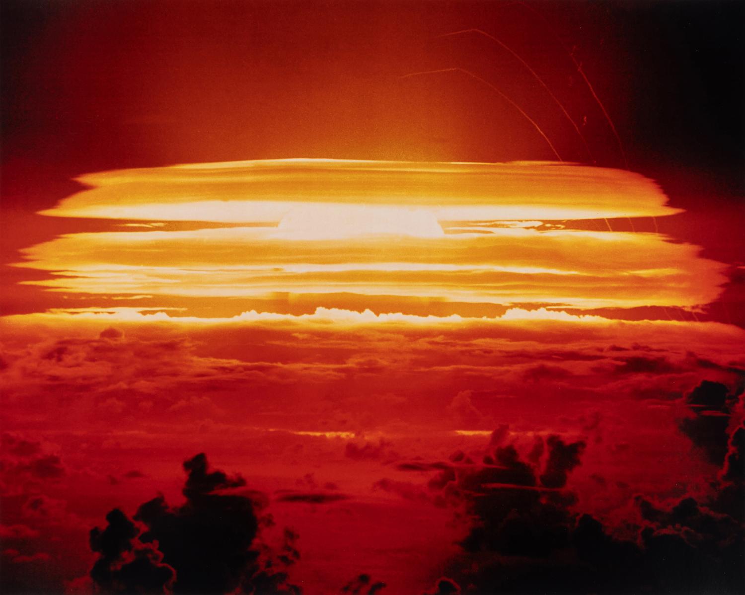 [OPERATION GREENHOUSE - DOG TEST]. Photograph of VIP observers lit up by the light of an atomic bomb on Enewetak Atoll 1951 (but printed 2009).
