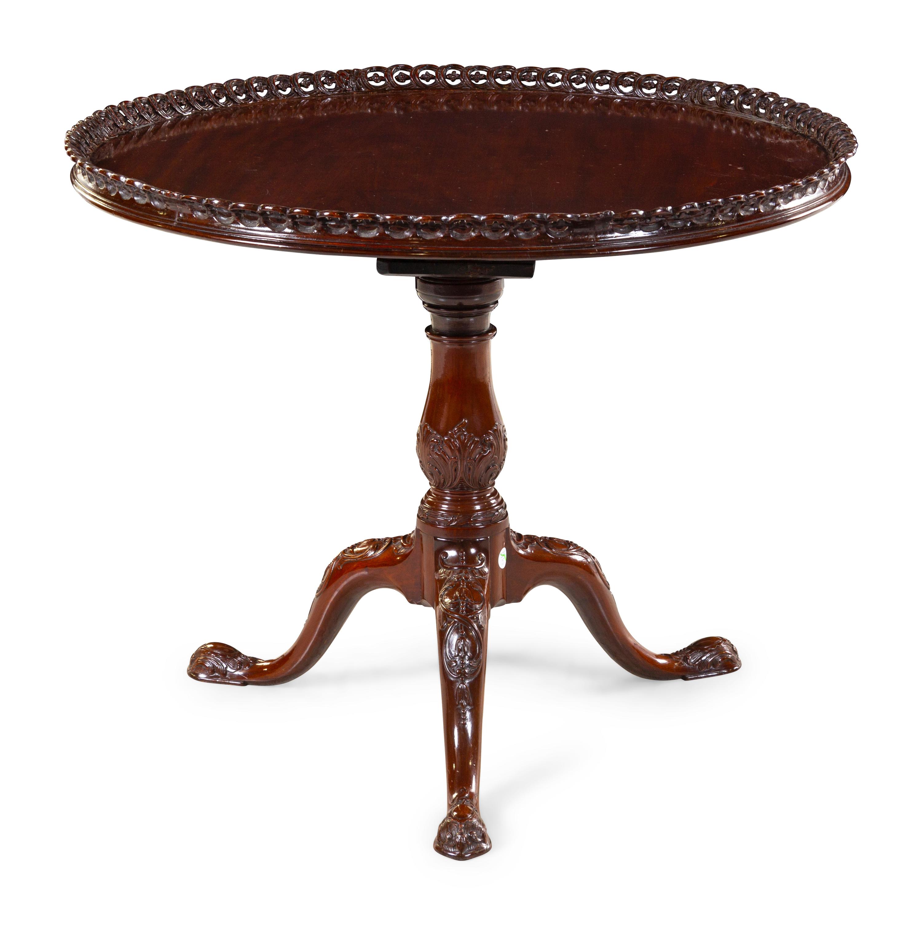 A Chippendale Style Carved, Pierced and Figured Mahogany Tilt-Top Tea Table
