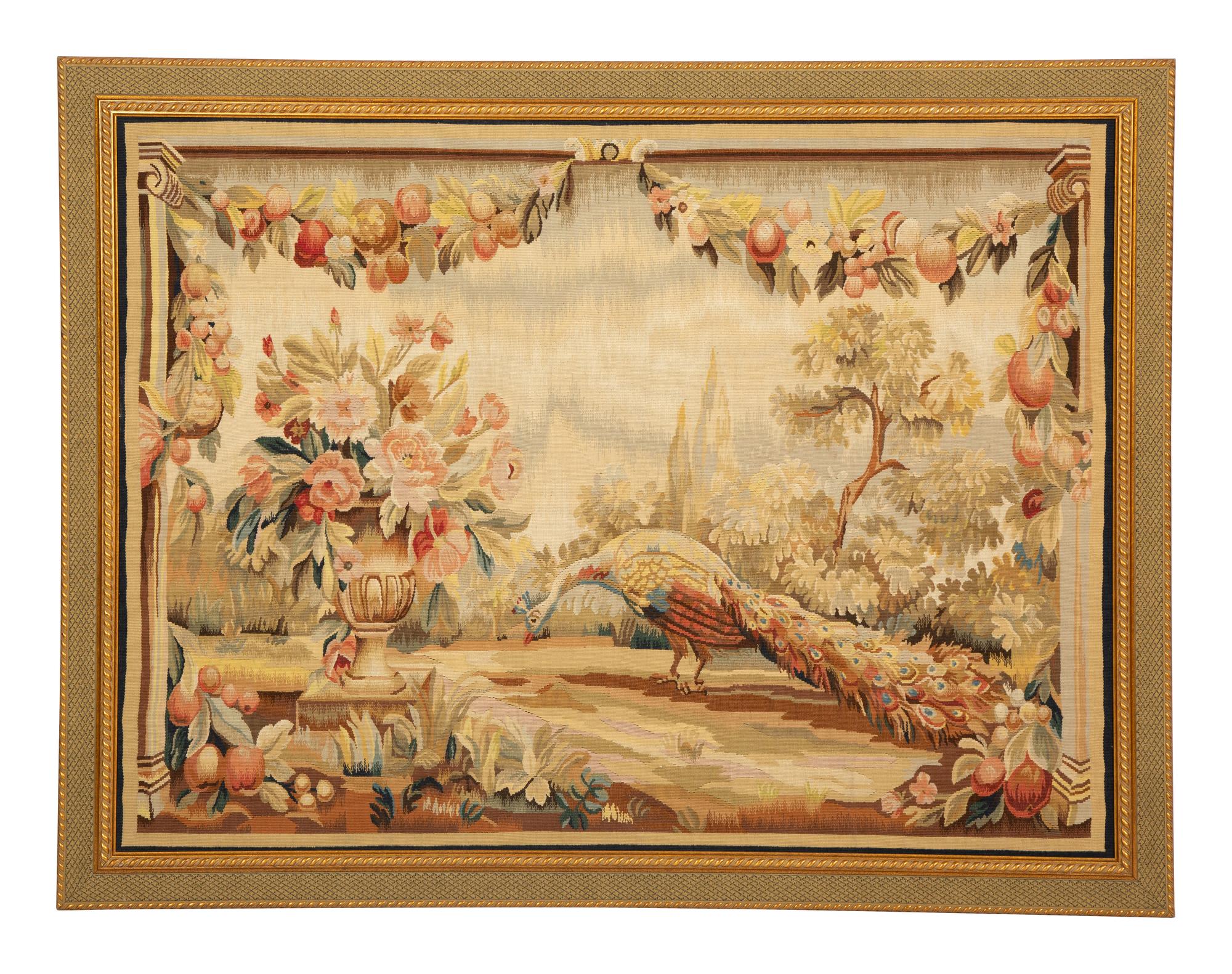 A Framed Needlework Panel Depicting a Peacock in Landscape