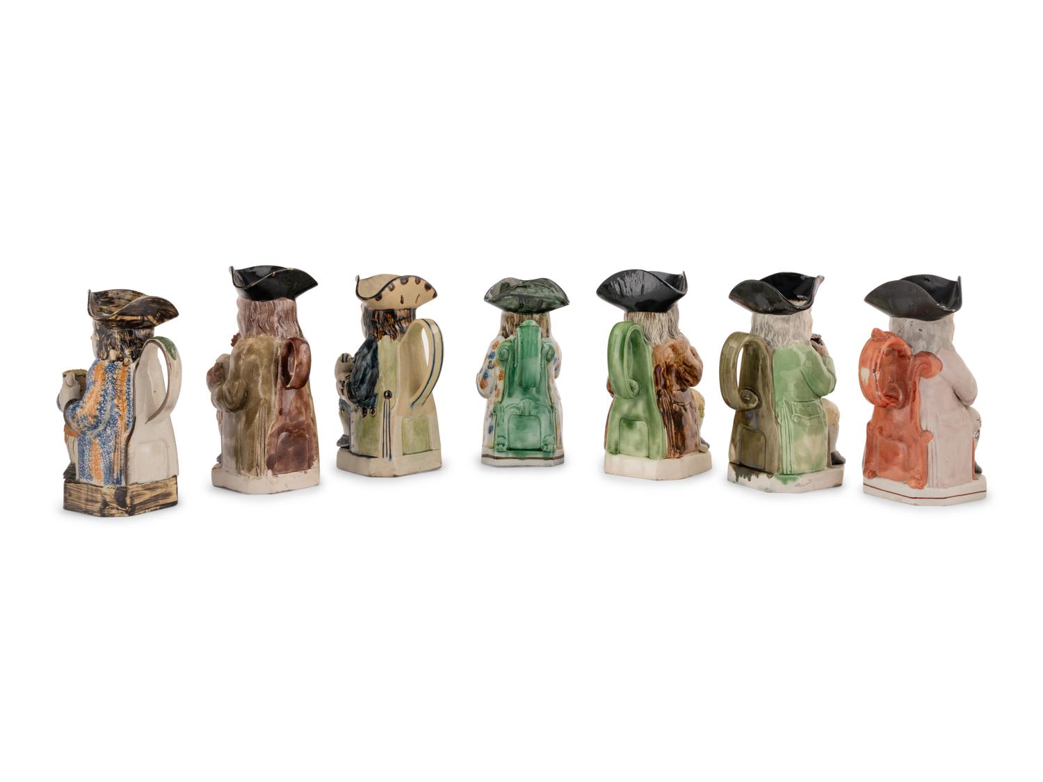 A Collection of Seven Ceramic Toby Mugs