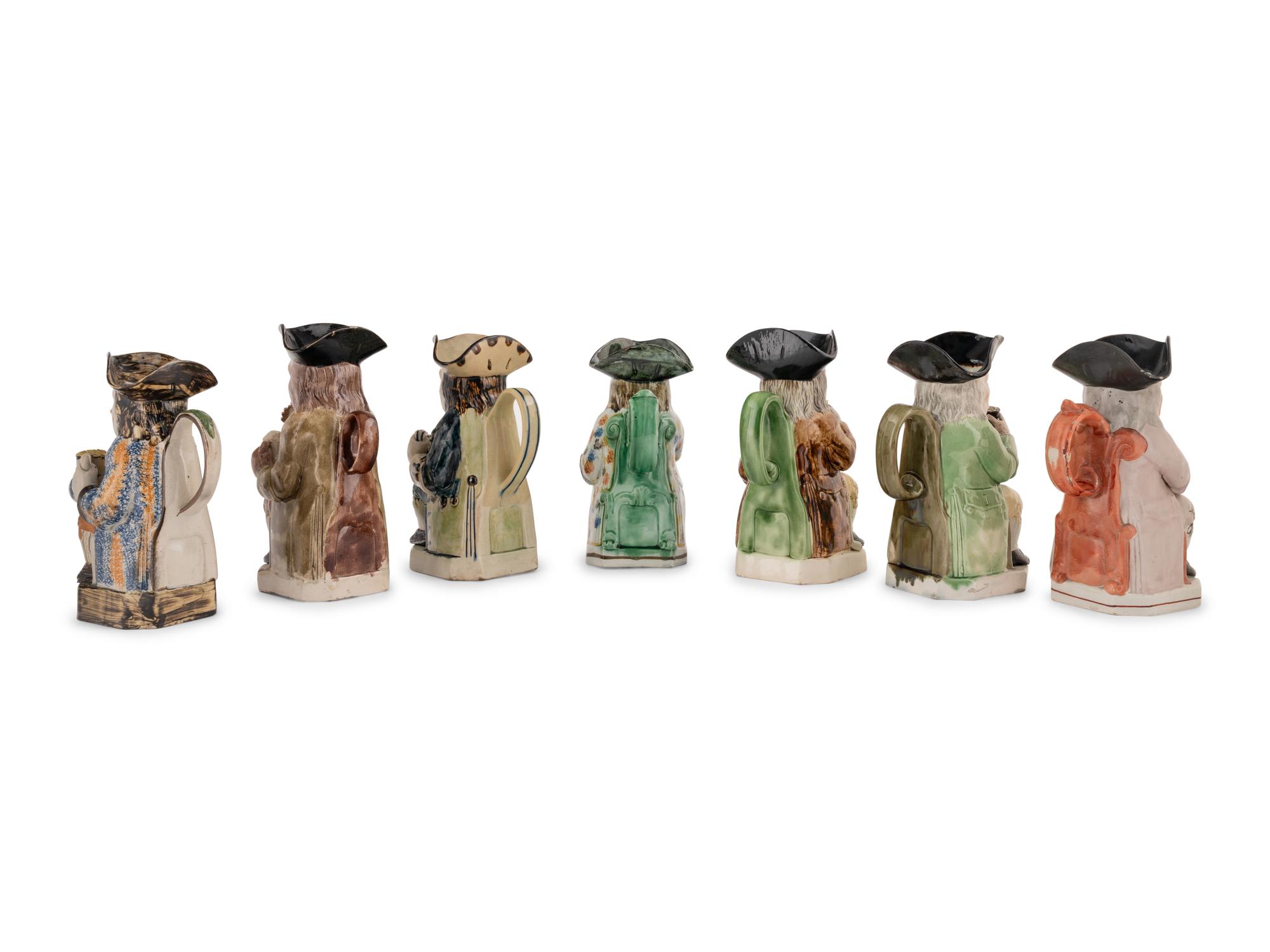 A Collection of Seven Ceramic Toby Mugs