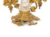 A Carved Rock Crystal Figure of Guanyin on a Grapevine Decorated Gilt Bronze Stand