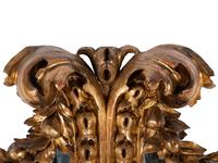 A Florentine Rococo Revival Carved Giltwood Mirror