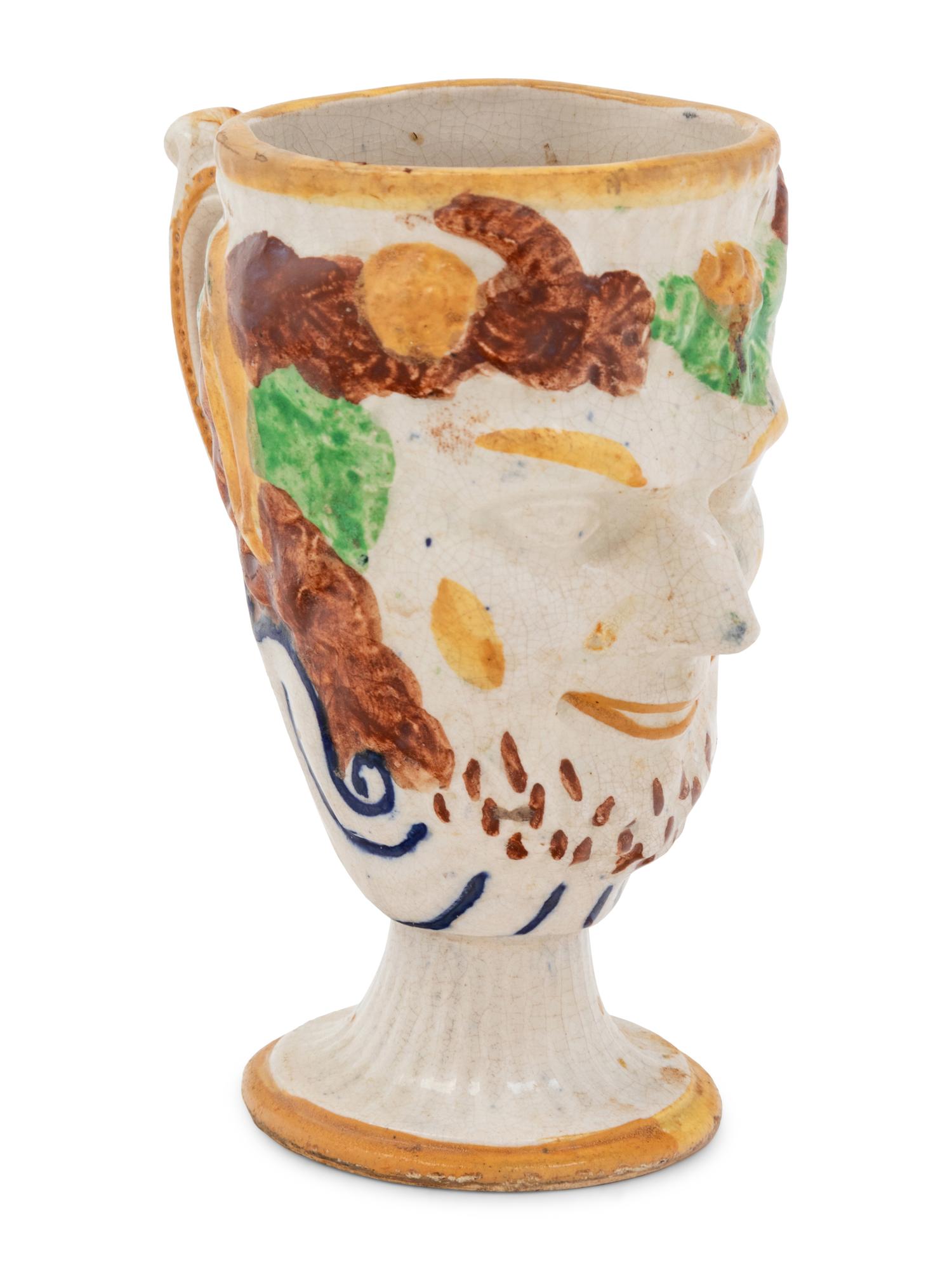 A Staffordshire Pottery Satyr Mug with an Interior Frog
