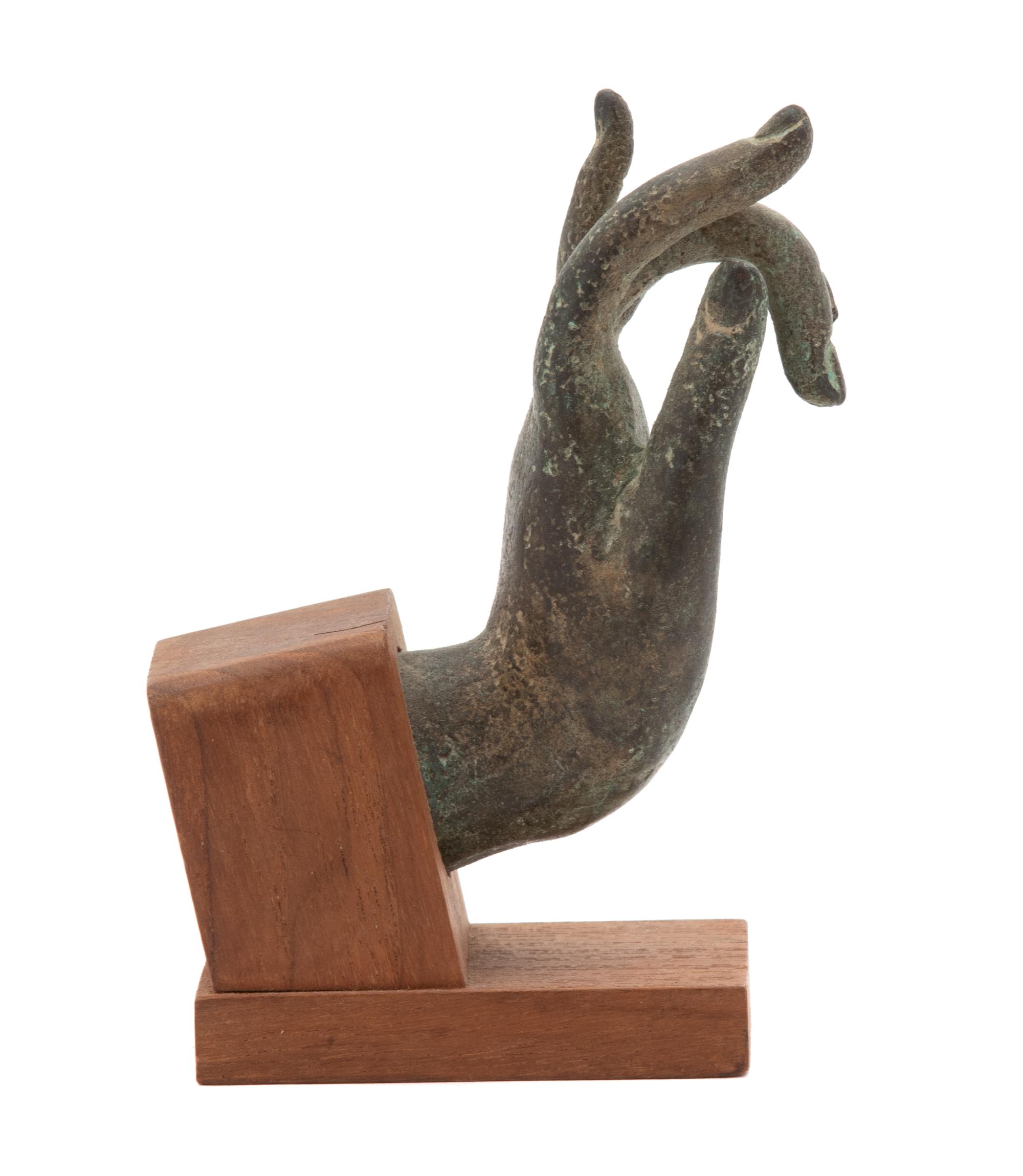 A Thai Bronze Hand of the Buddha Height 4 inches. — 19TH/20TH CENTURY