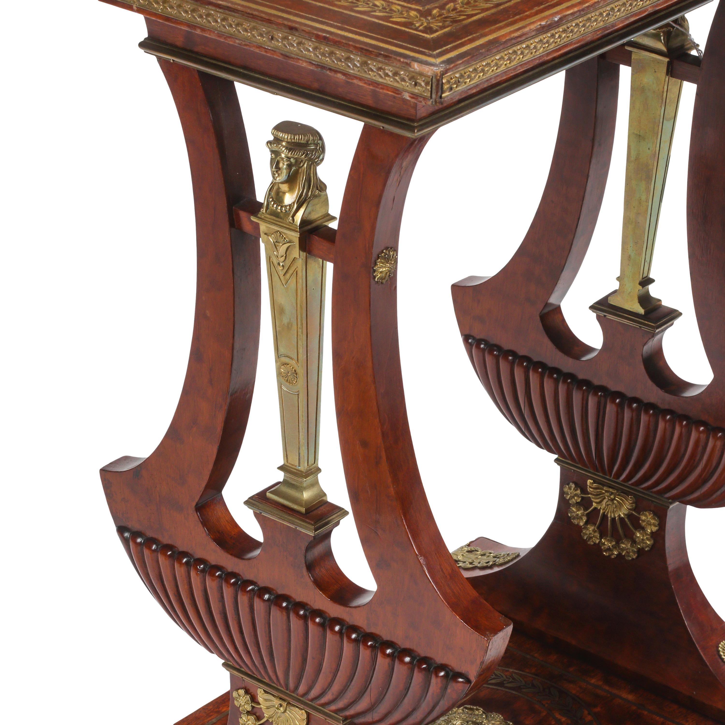 An Empire Style Mahogany and Gilt Bronze Mounted Table