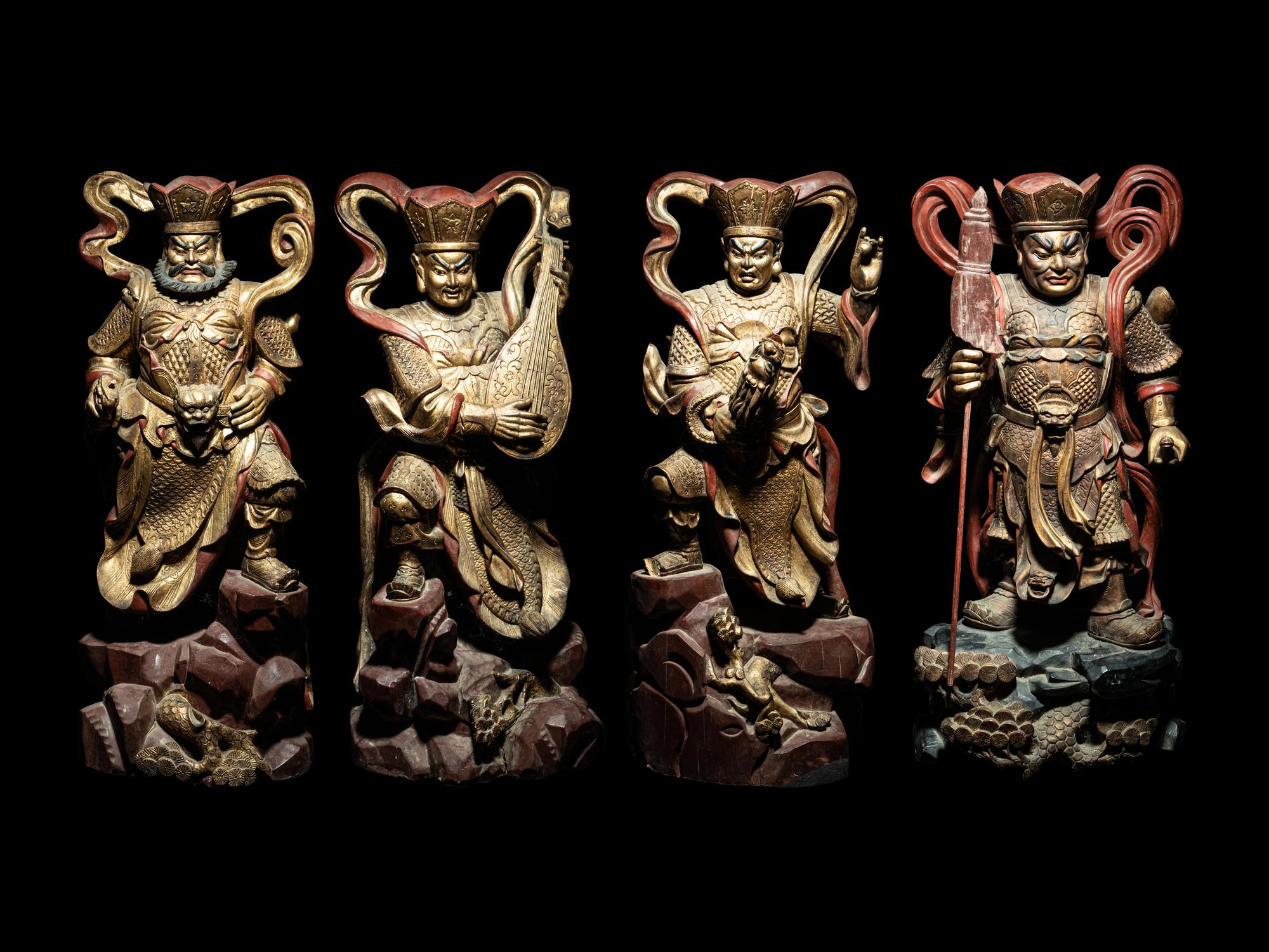 A Set of Four Gilt and Red Lacquered Wood Figures of Guardians