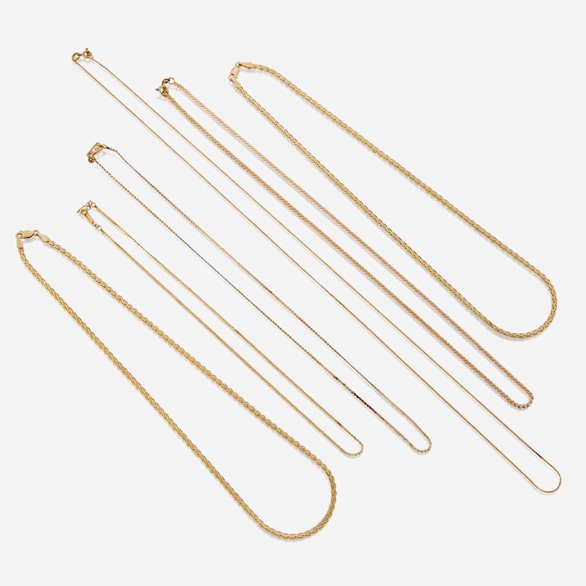 A collection of six fourteen karat gold necklaces