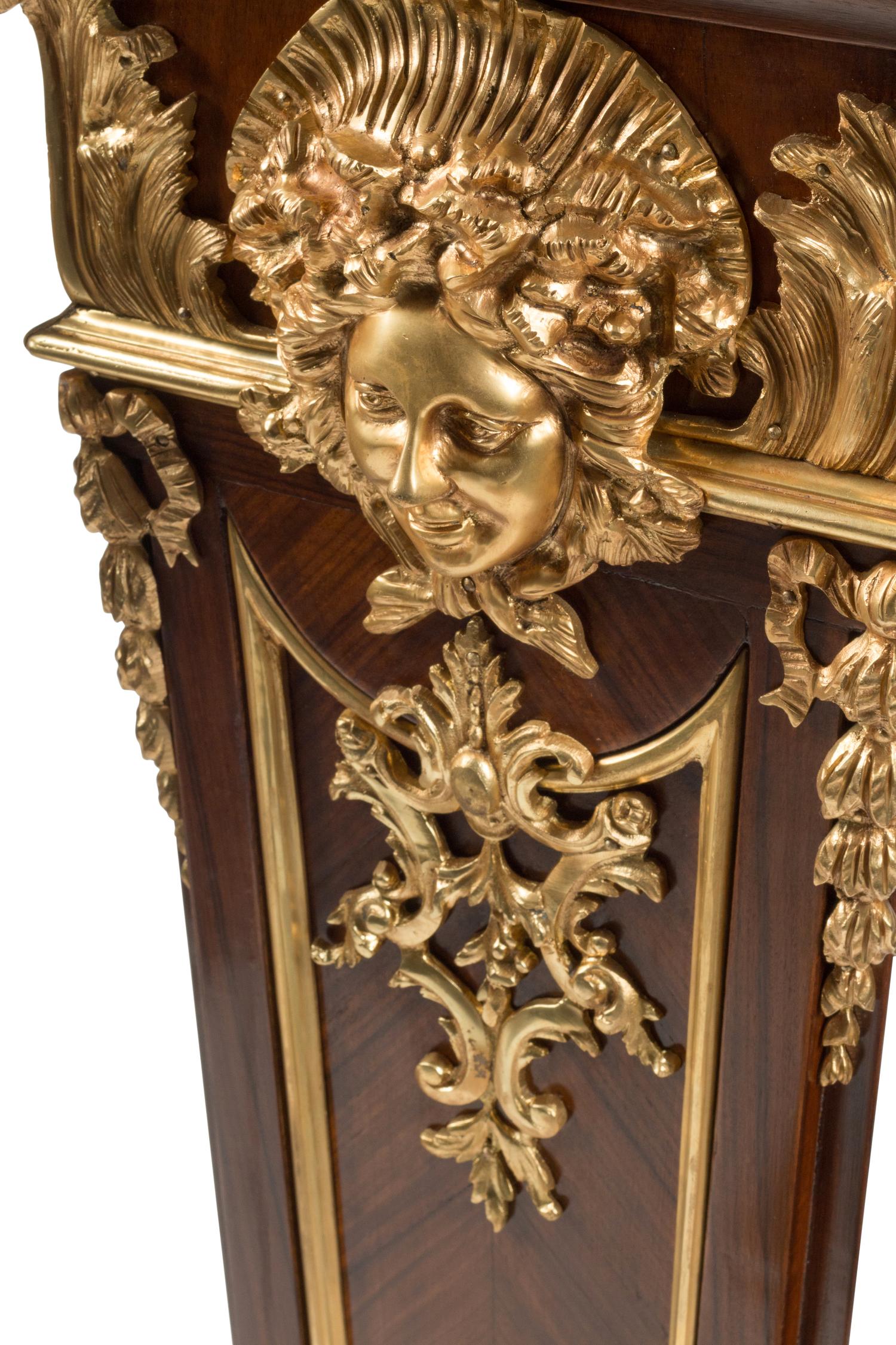 A Pair of Régence Style Gilt Bronze Mounted Bookmatch-Veneered Pedestals