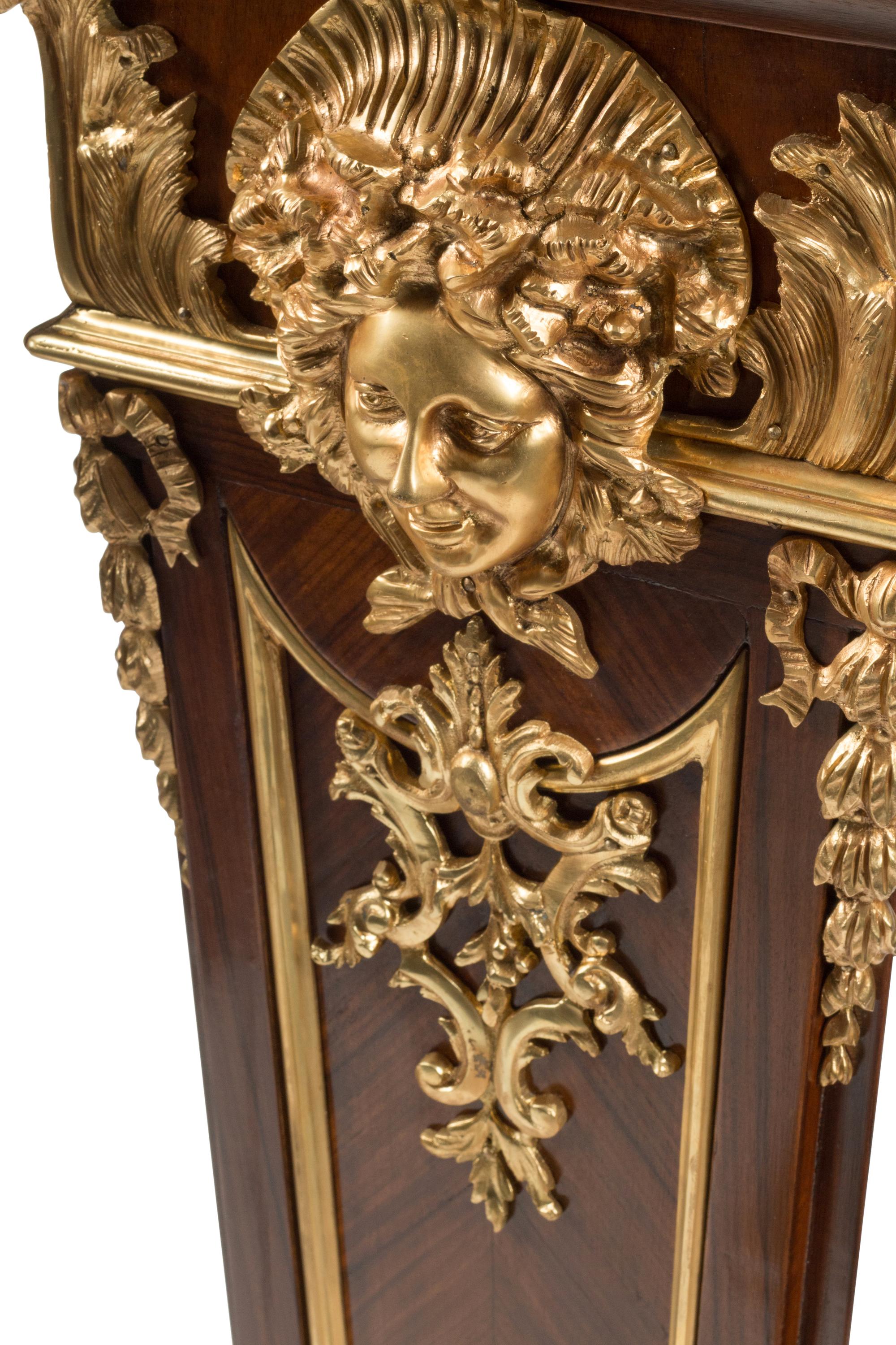 A Pair of Régence Style Gilt Bronze Mounted Bookmatch-Veneered Pedestals