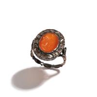 A Neoclassical Silver and Carnelian Finger Ring with a Portrait Head of a Woman Inside a Halo of Diamonds