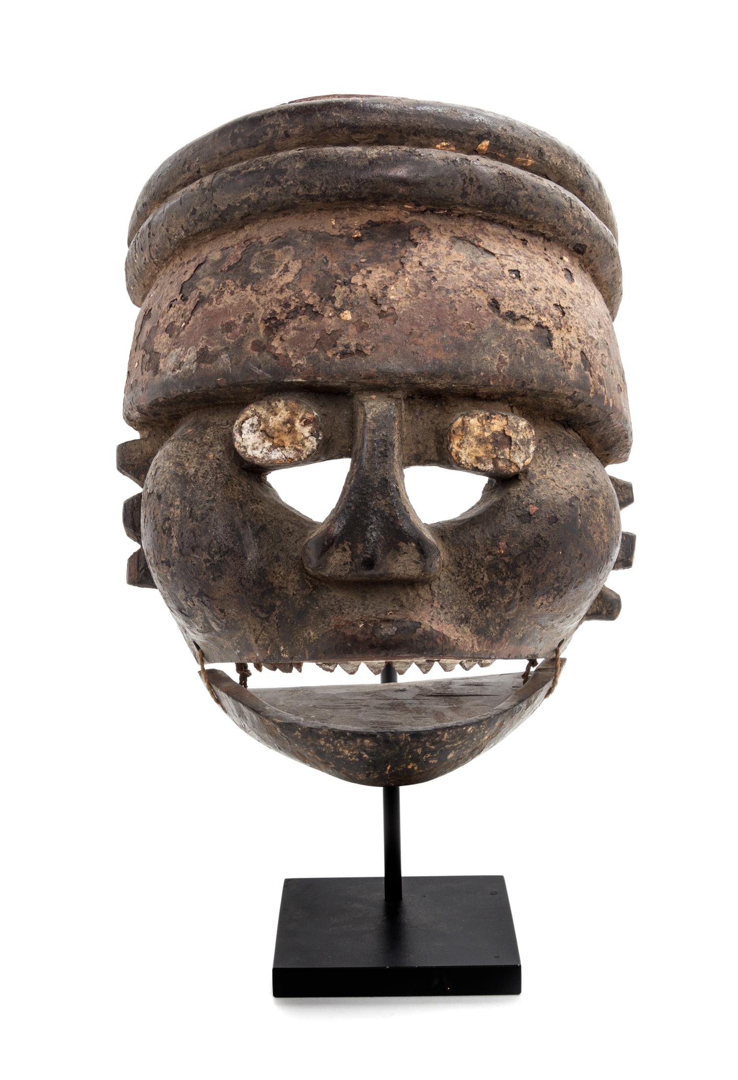 A Nigerian Ibibio Wood Face Mask Height 12 x width 9 1/2 x depth 6 1/2 inches. — 20TH CENTURY