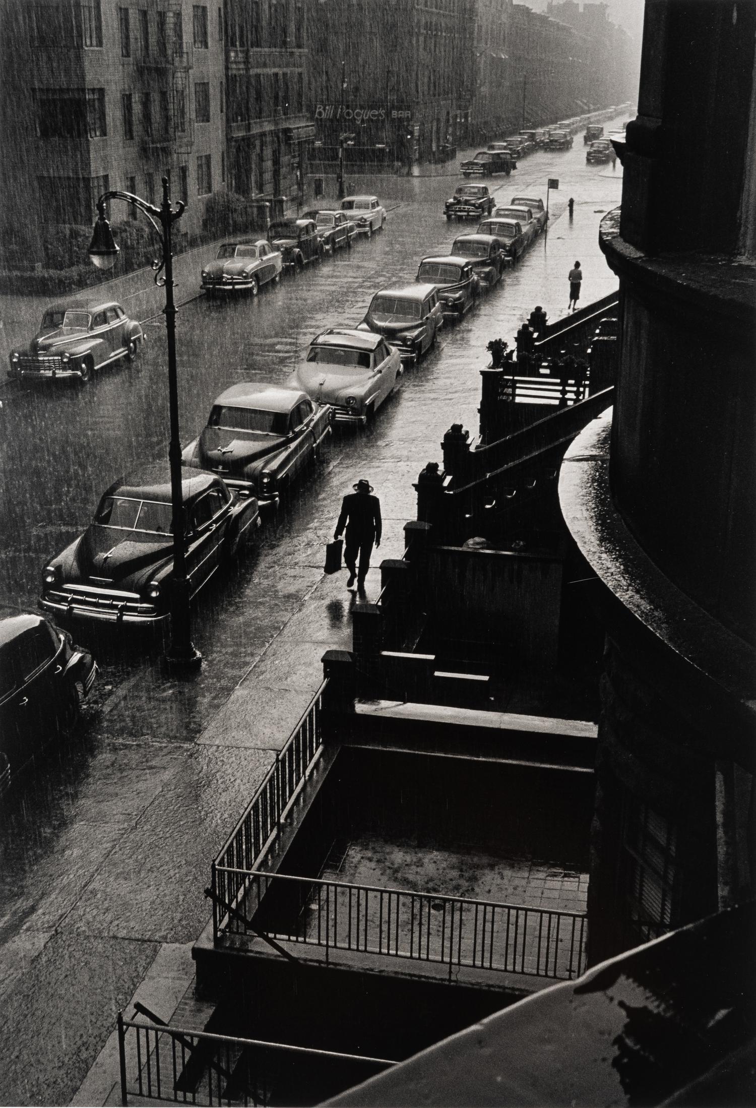 Ruth Orkin (1921-1985) Man in Rain, West 88th Street, New York City, 1952