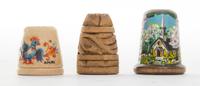 A Collection of Three Wood Thimbles Height of tallest 1 1/8 inches.