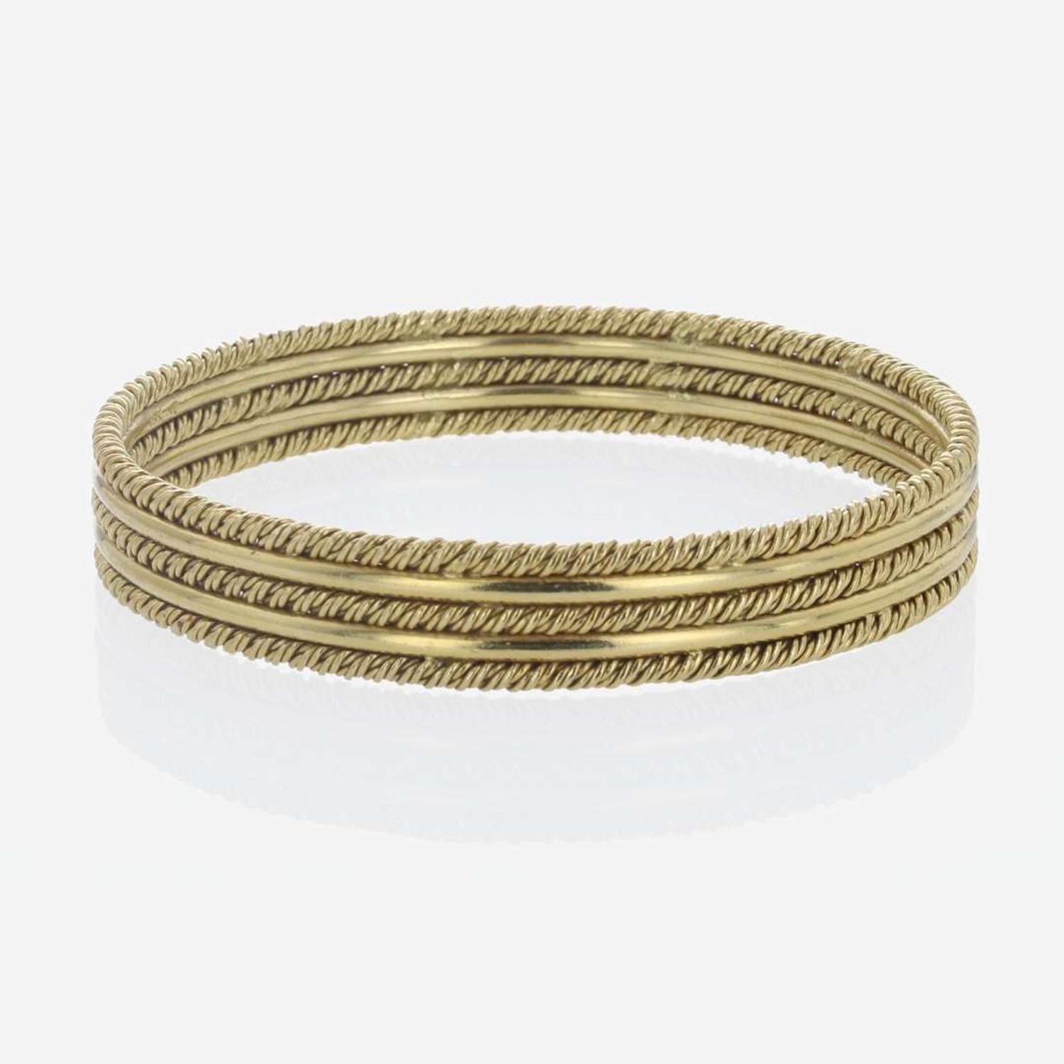 An 18K Yellow Gold Craig Drake Bangle Bracelet