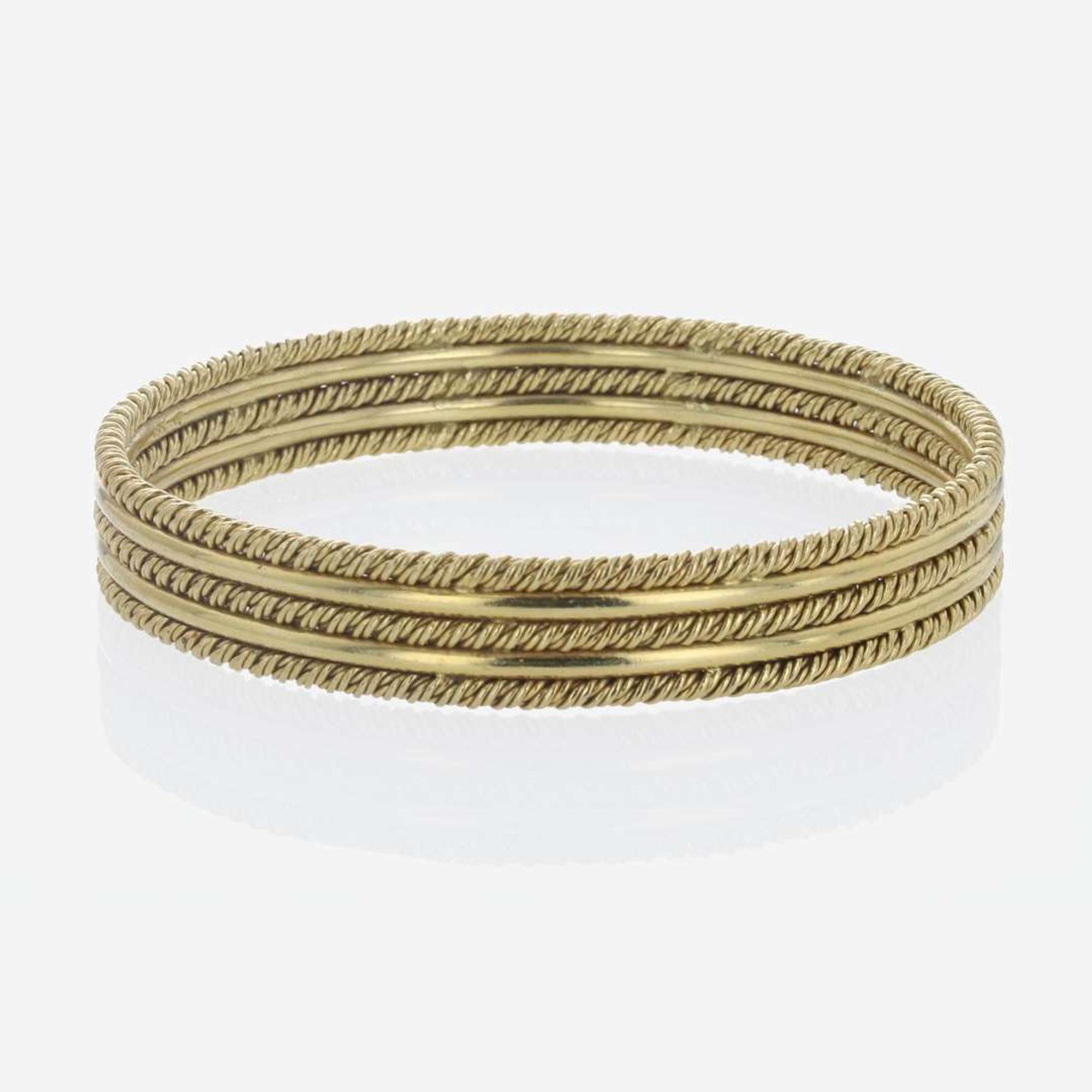 An 18K Yellow Gold Craig Drake Bangle Bracelet
