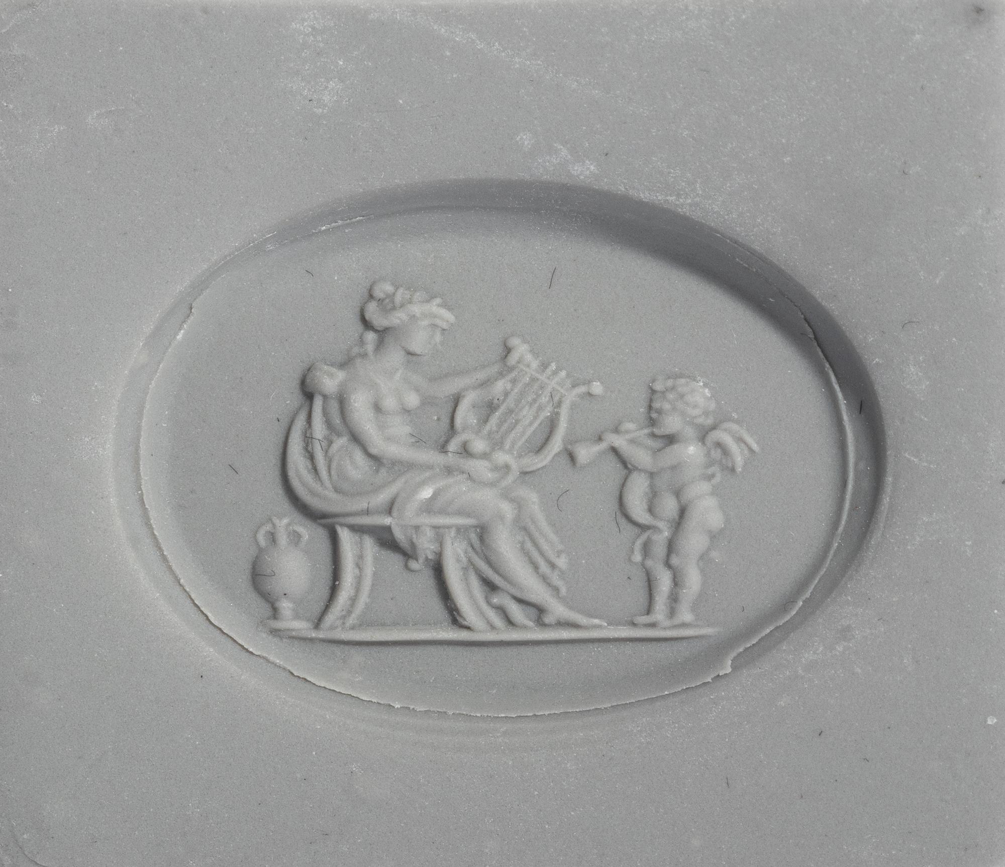 A Neoclassical Gold and Carnelian Finger Ring with a Muse Playing a Harp
