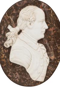 A Set of Four Italian Carved Marble and Iron Mounted Profile Medallions
