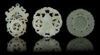 Three Carved Jade Pendants Diameter of first 2 1/8 inches.