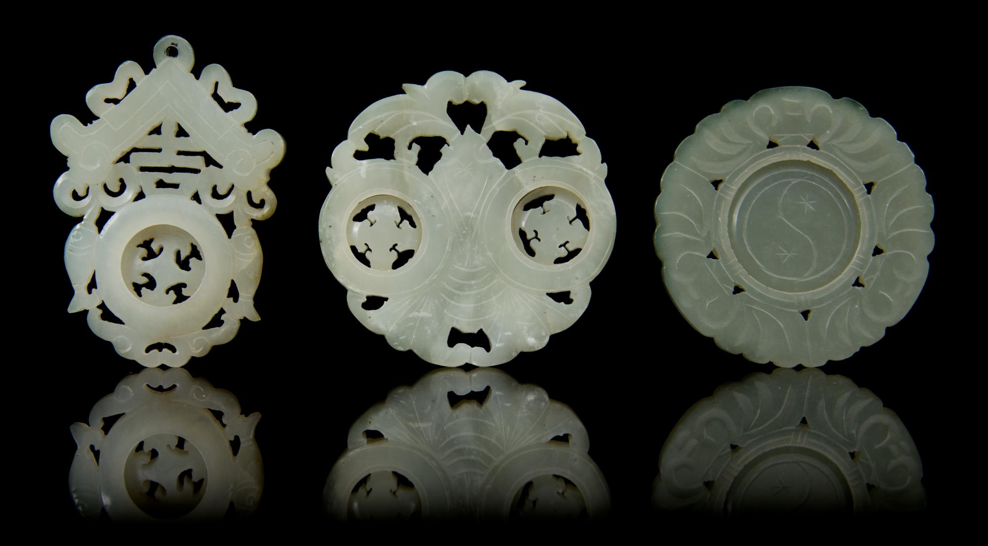 Three Carved Jade Pendants Diameter of first 2 1/8 inches.