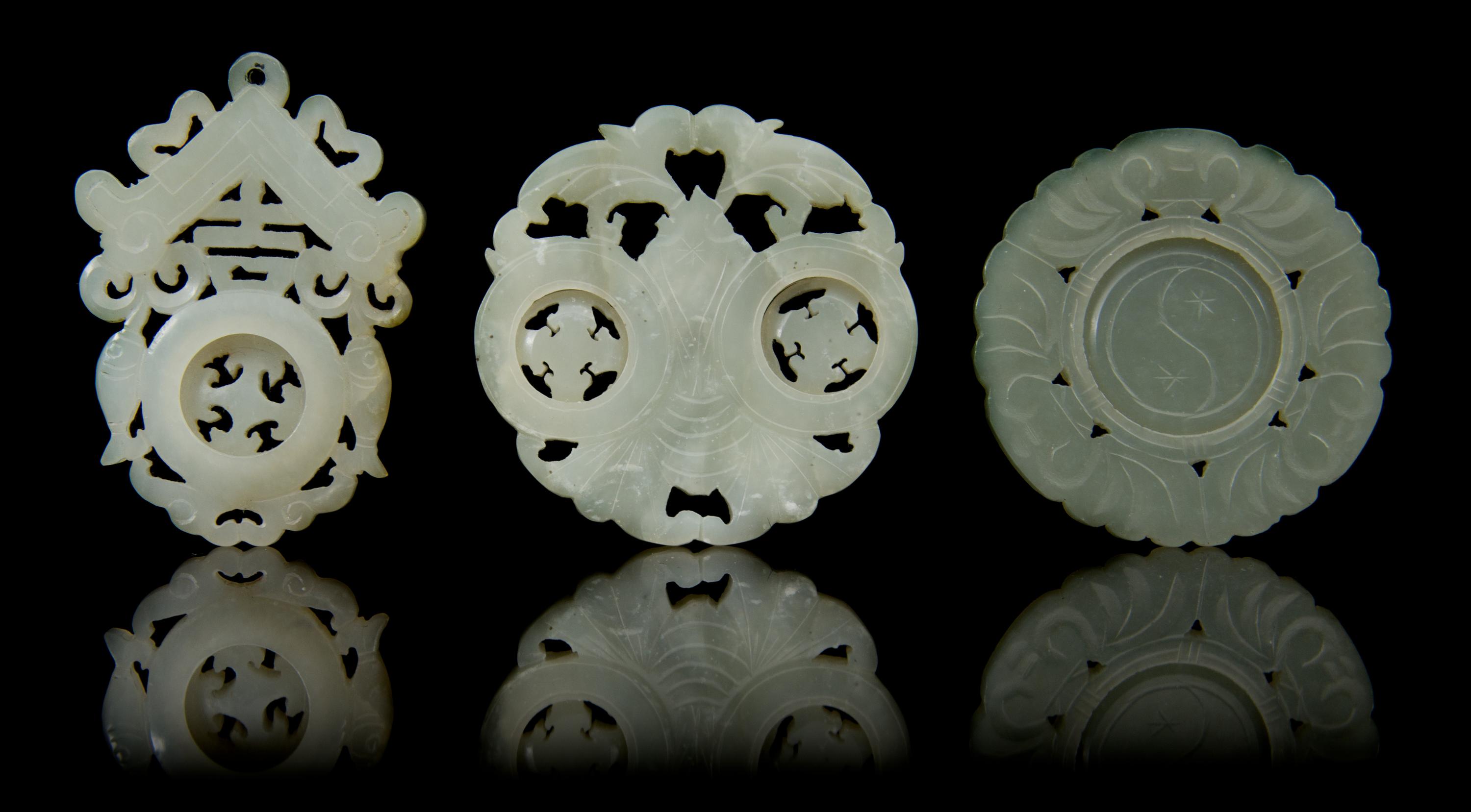 Three Carved Jade Pendants Diameter of first 2 1/8 inches.