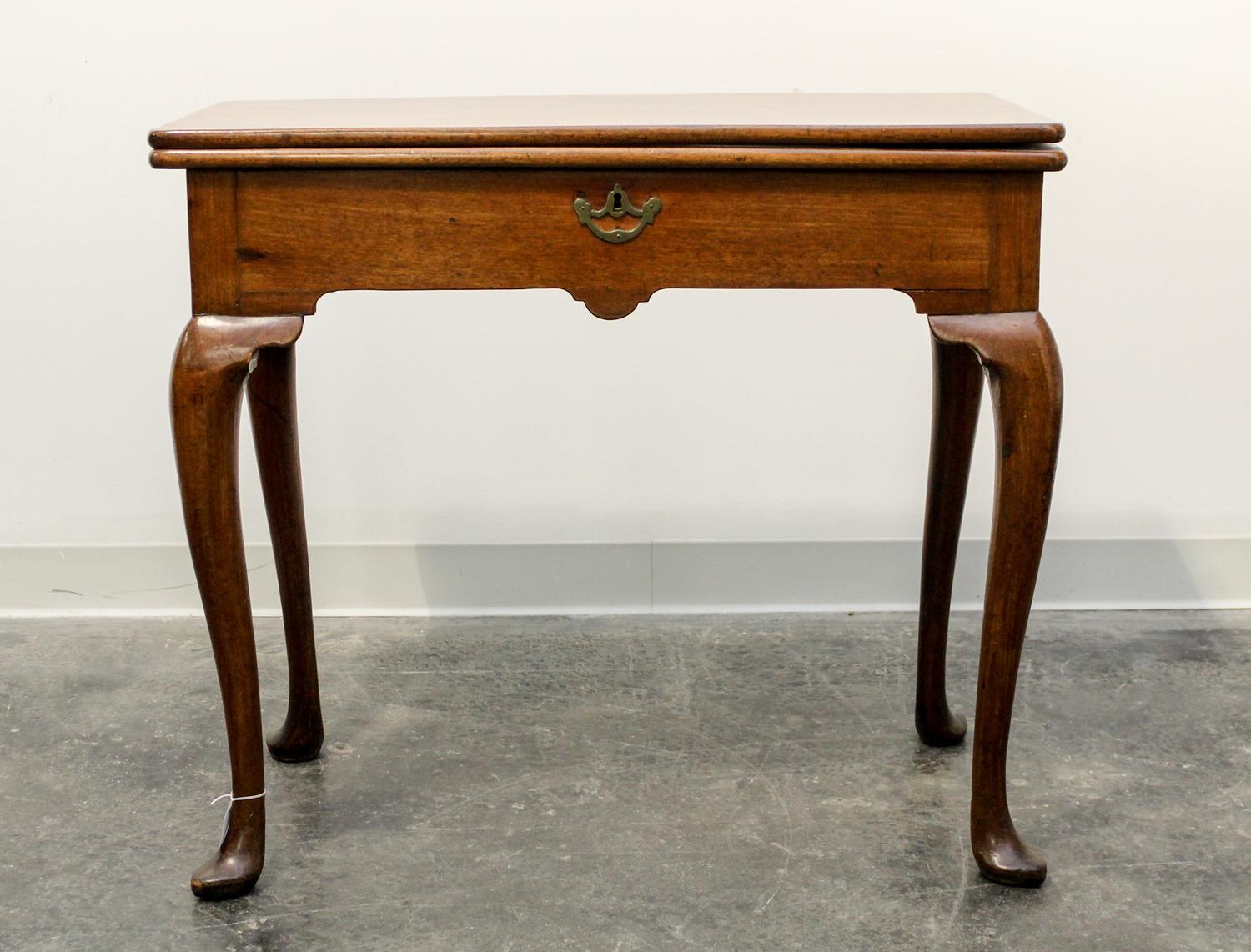 An English Mahogany Flip-Top Game Table — 18TH CENTURY
