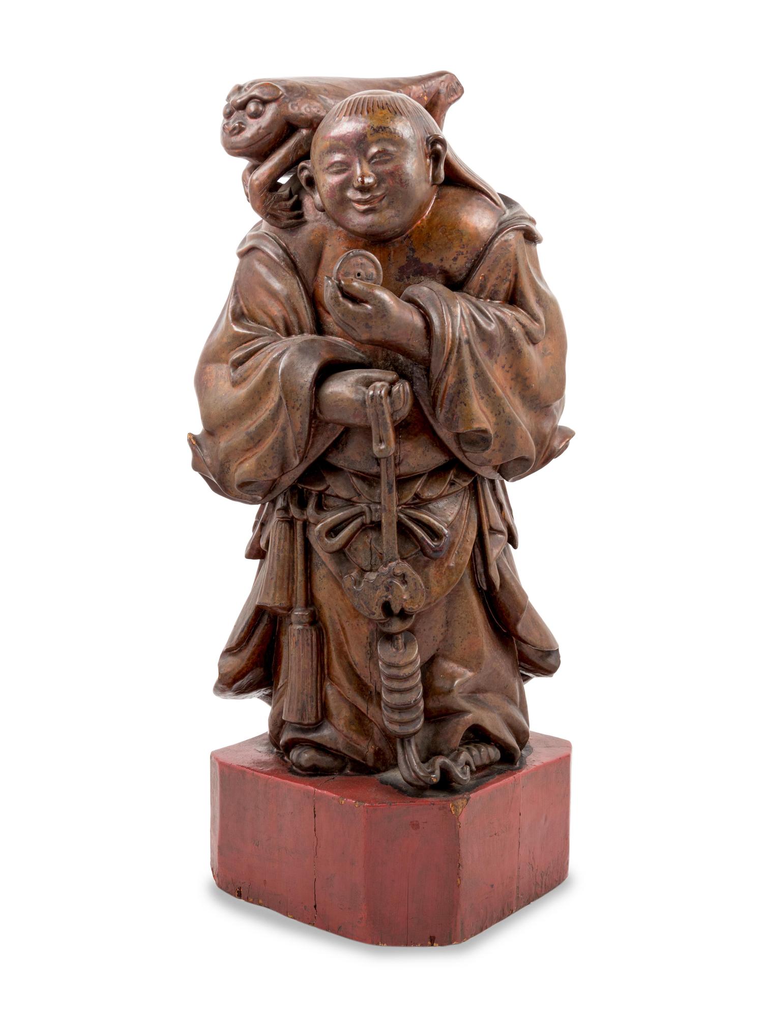 A Chinese Gilt Lacquered Wood Figure of Immortal Liu Hai