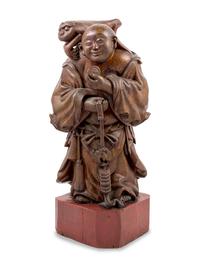 A Chinese Gilt Lacquered Wood Figure of Immortal Liu Hai