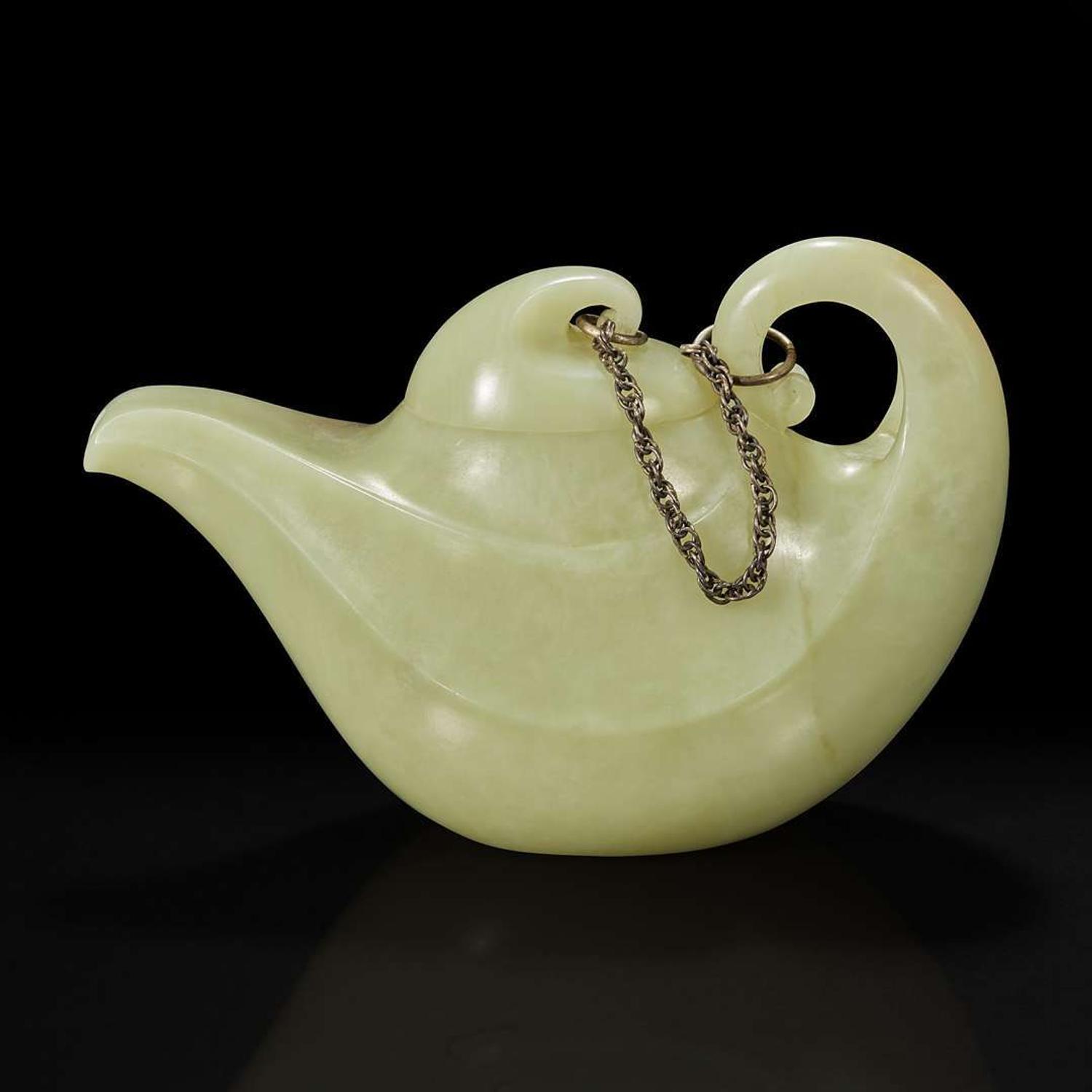 A Chinese yellowish-celadon jade teapot and cover 青黄玉雕带盖茶壶