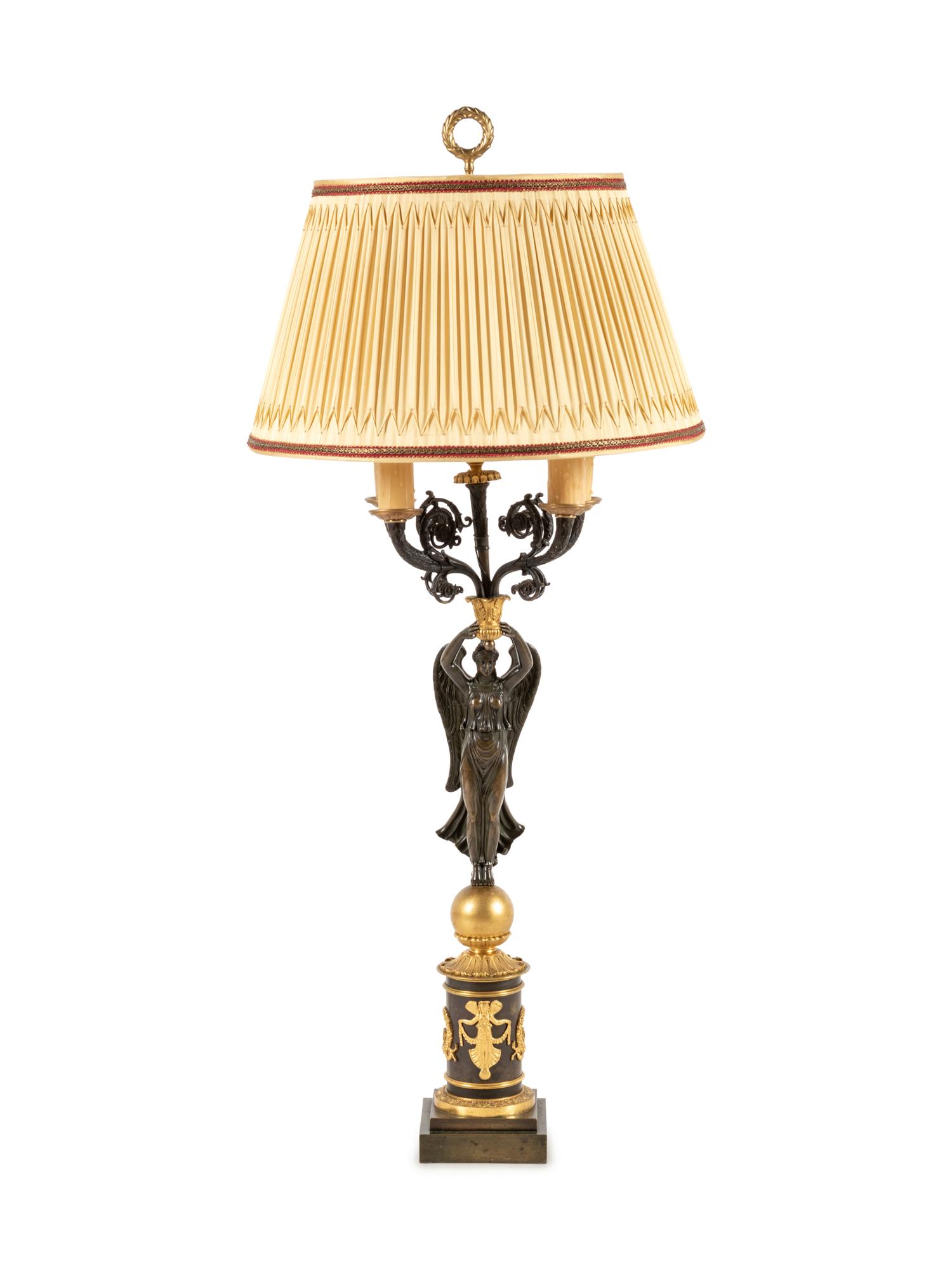 An Empire Style Gilt and Patinated Bronze Figural Five-Light Candelabrum