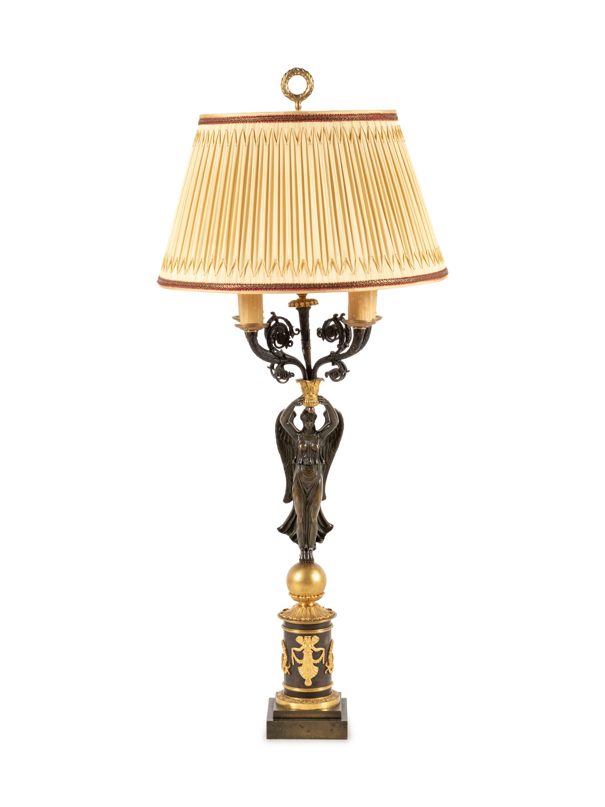 An Empire Style Gilt and Patinated Bronze Figural Five-Light Candelabrum
