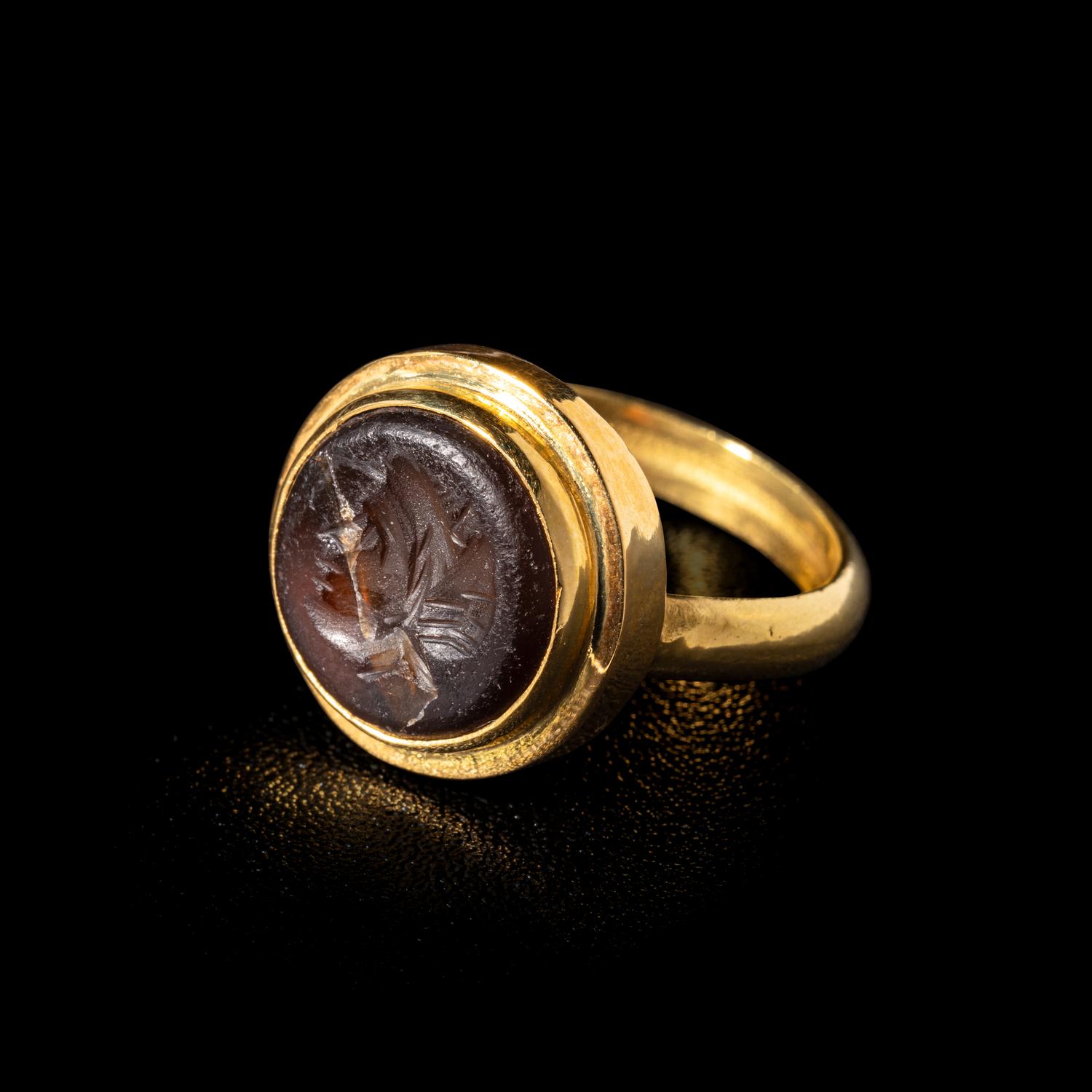 A Roman Carnelian Ring Stone with a Female Portrait Head — Set in a modern gold ring