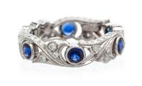 A Platinum, Diamond and Sapphire Eternity Band, 4.30 dwts.