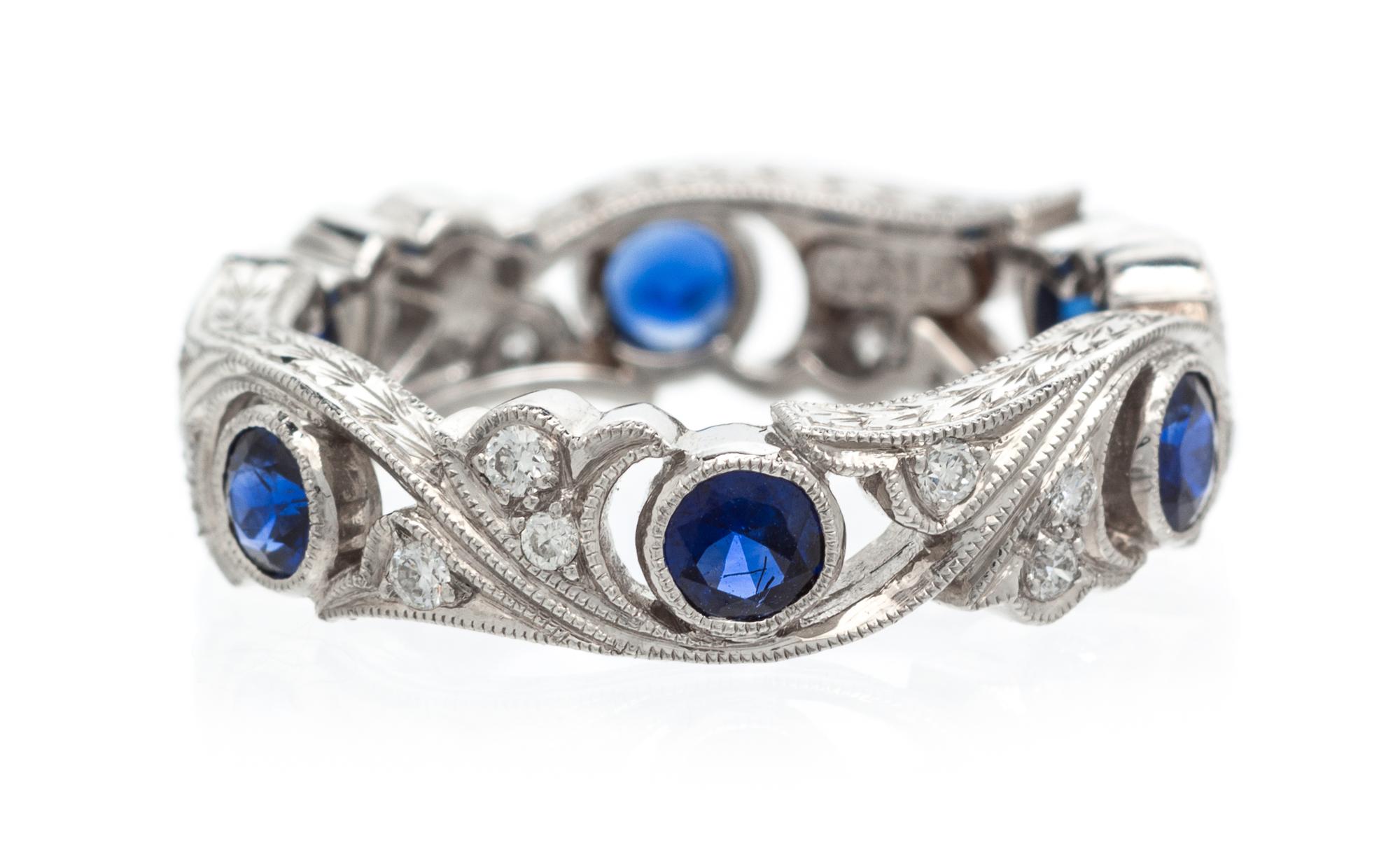 A Platinum, Diamond and Sapphire Eternity Band, 4.30 dwts.